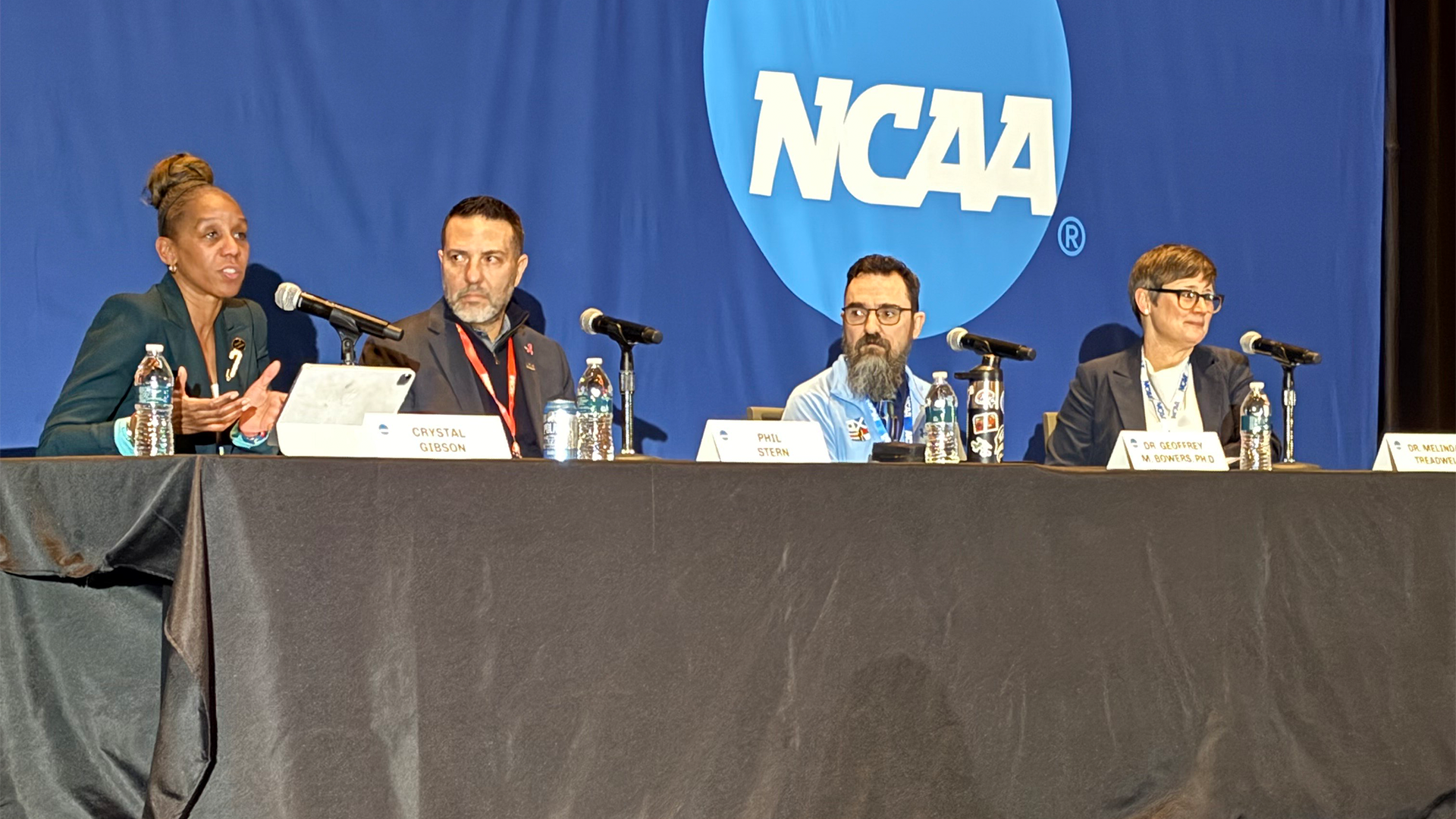 Crystal Gibson along with three other panelists sitting on stage at 2026 NCAA Convention