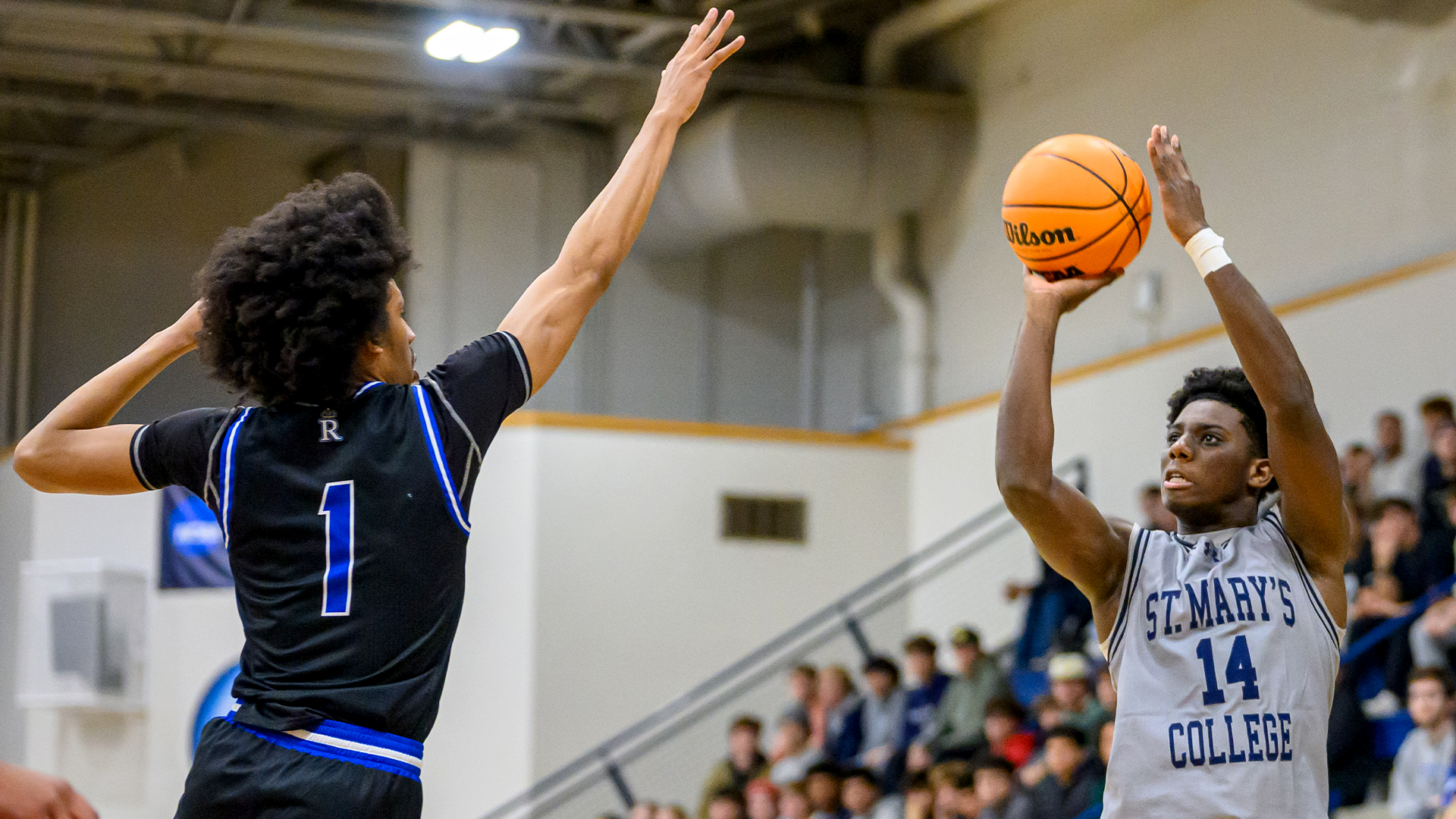 Sekou Bangoura poised for a shot with a Regent defender's hand in his face on Nov. 12, 2025