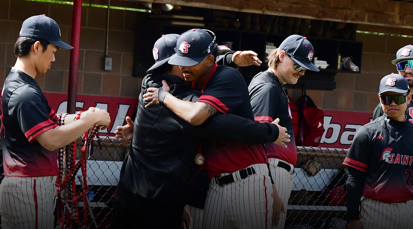 Isaiah Mayfield-Prieto hugging a teammate at the 2025 SMU Baseball Senior Day presentation