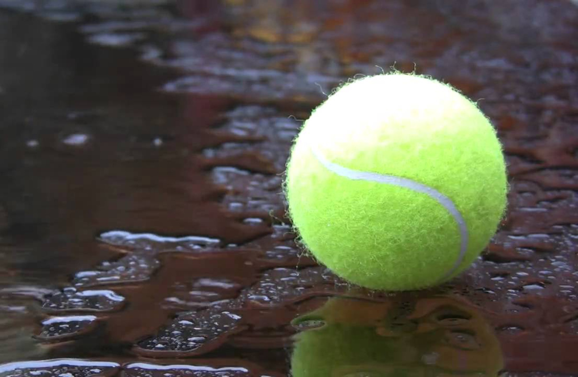 a tennis ball in the rain