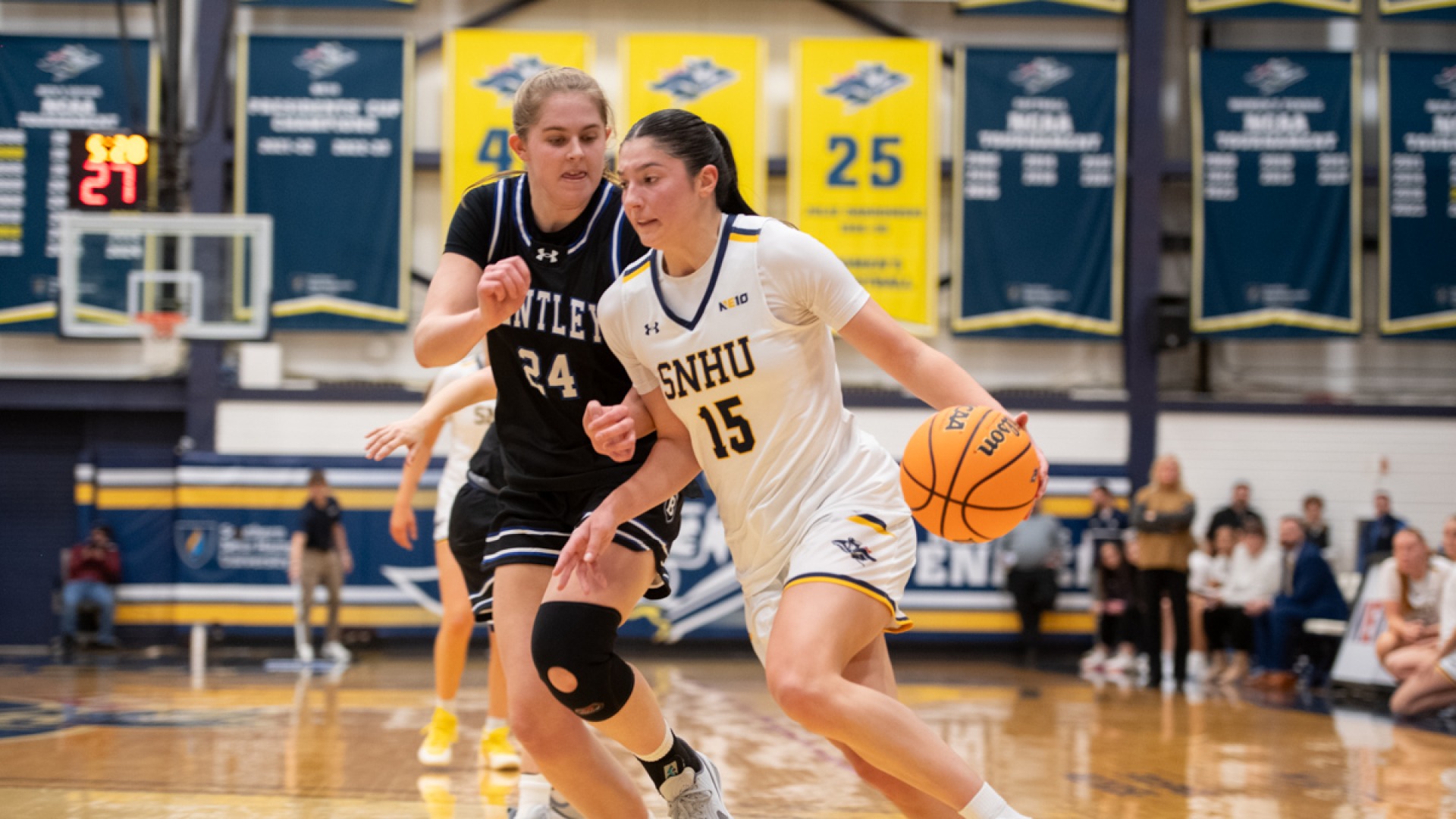 Meghan Gordon of women's basketball drives to the basket