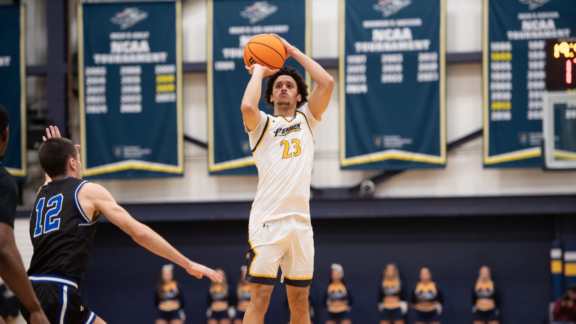 Jojo Wallace elevates to take a shot for men's basketball