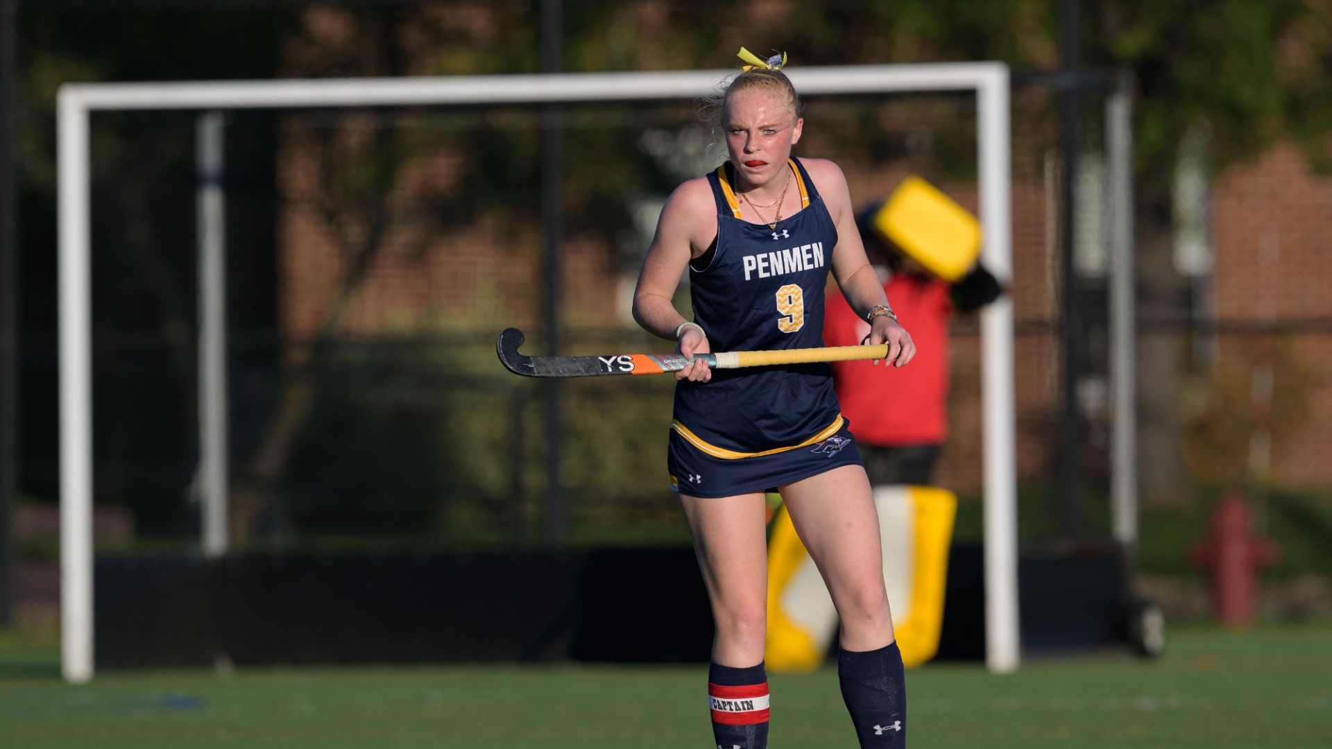 Field hockey player Minke van de Pol holding her stick