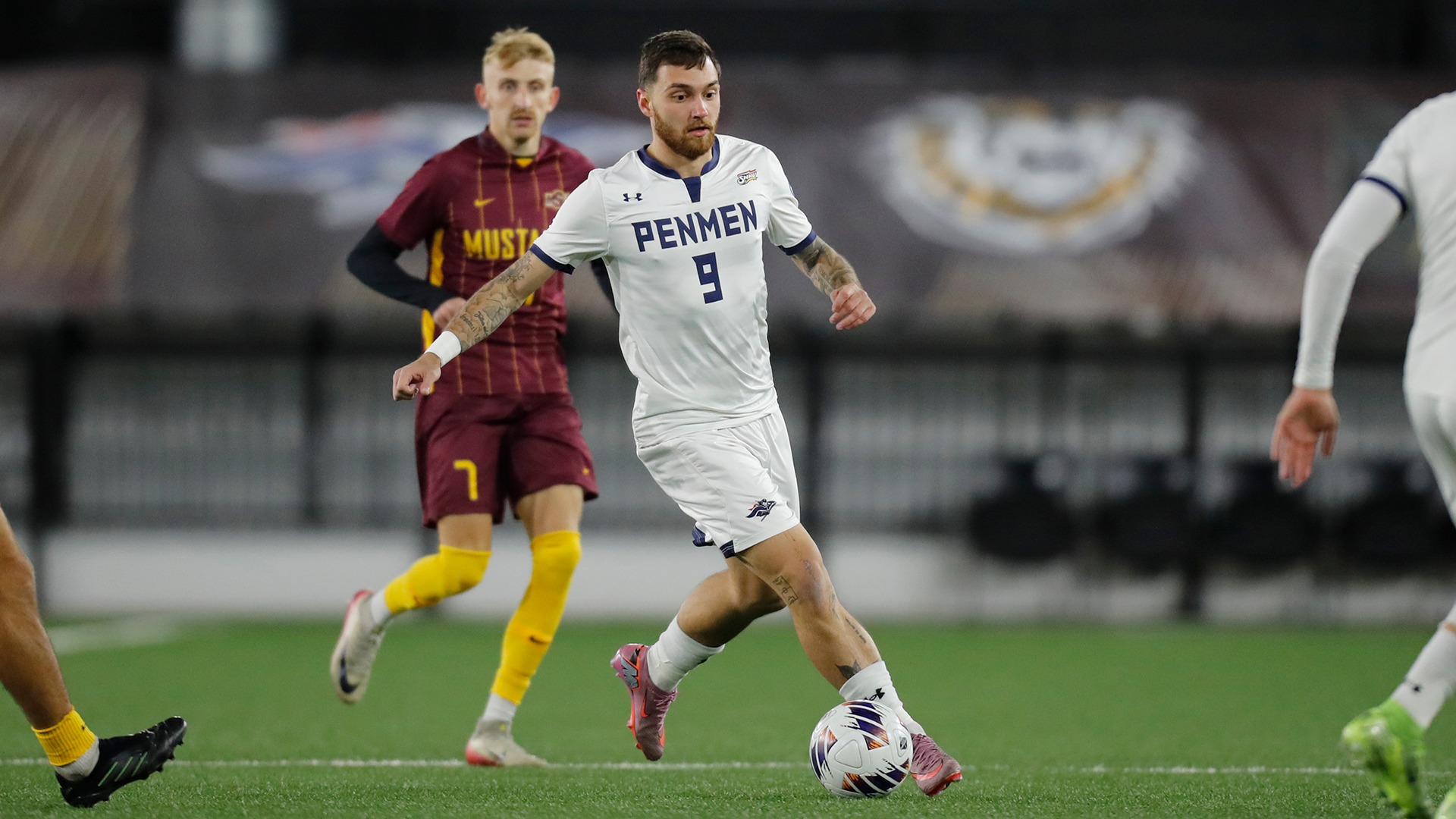 Philipp Herrmann dribbling with a defender in the background