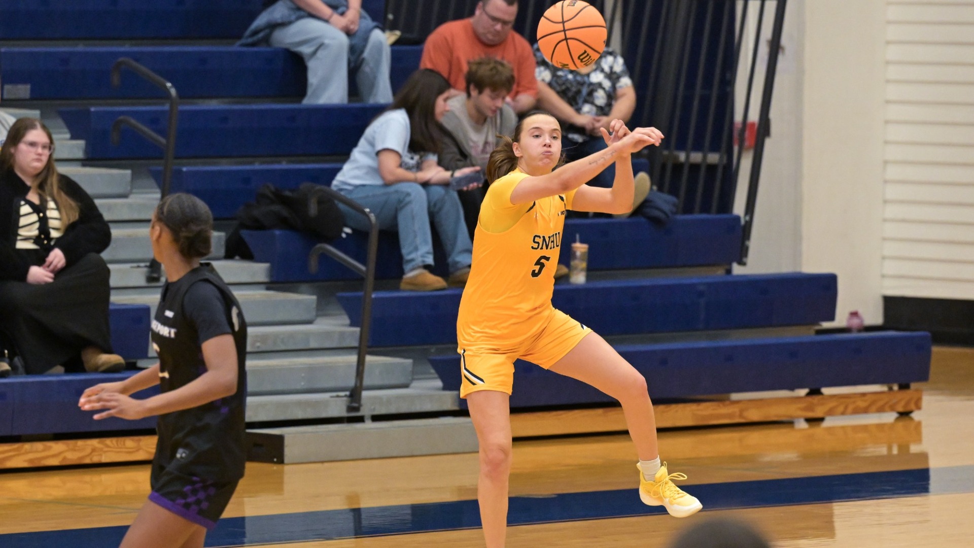 Taylor Brennan of women's basketball looks to lead a break as she sets up for a long pass