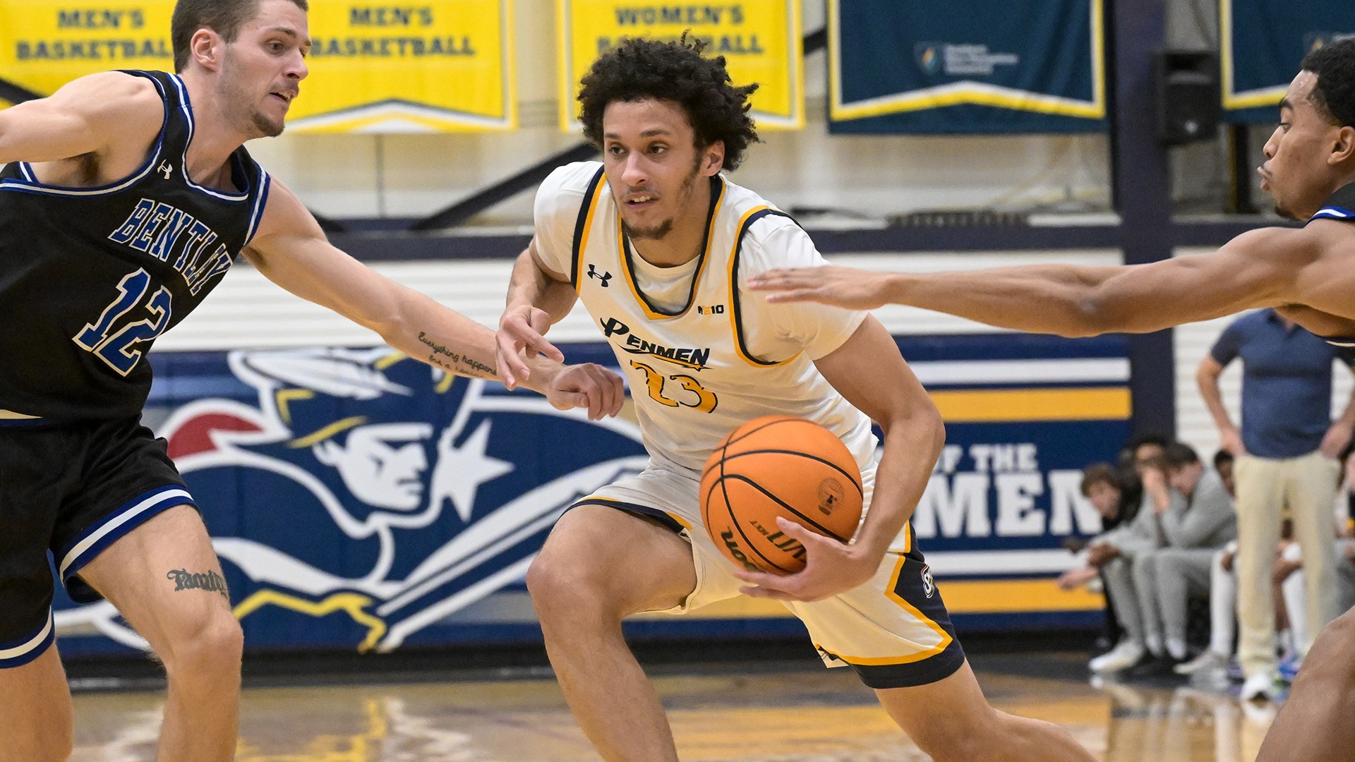 Wallace drives to the hoop between two reaching defenders