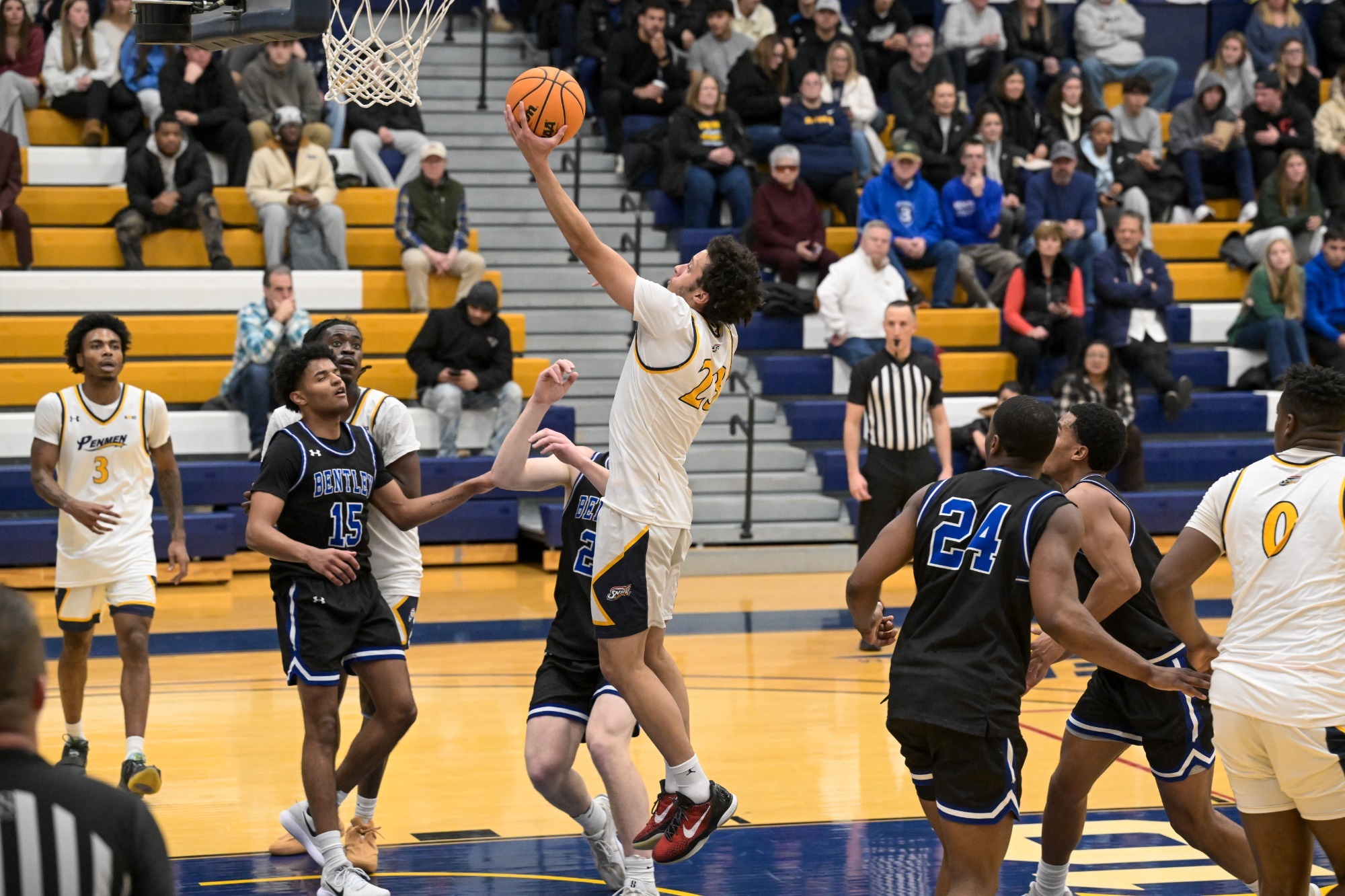 Jojo Wallace drives to the basket as T.J. Morris and Ugo Nwachukwu look on