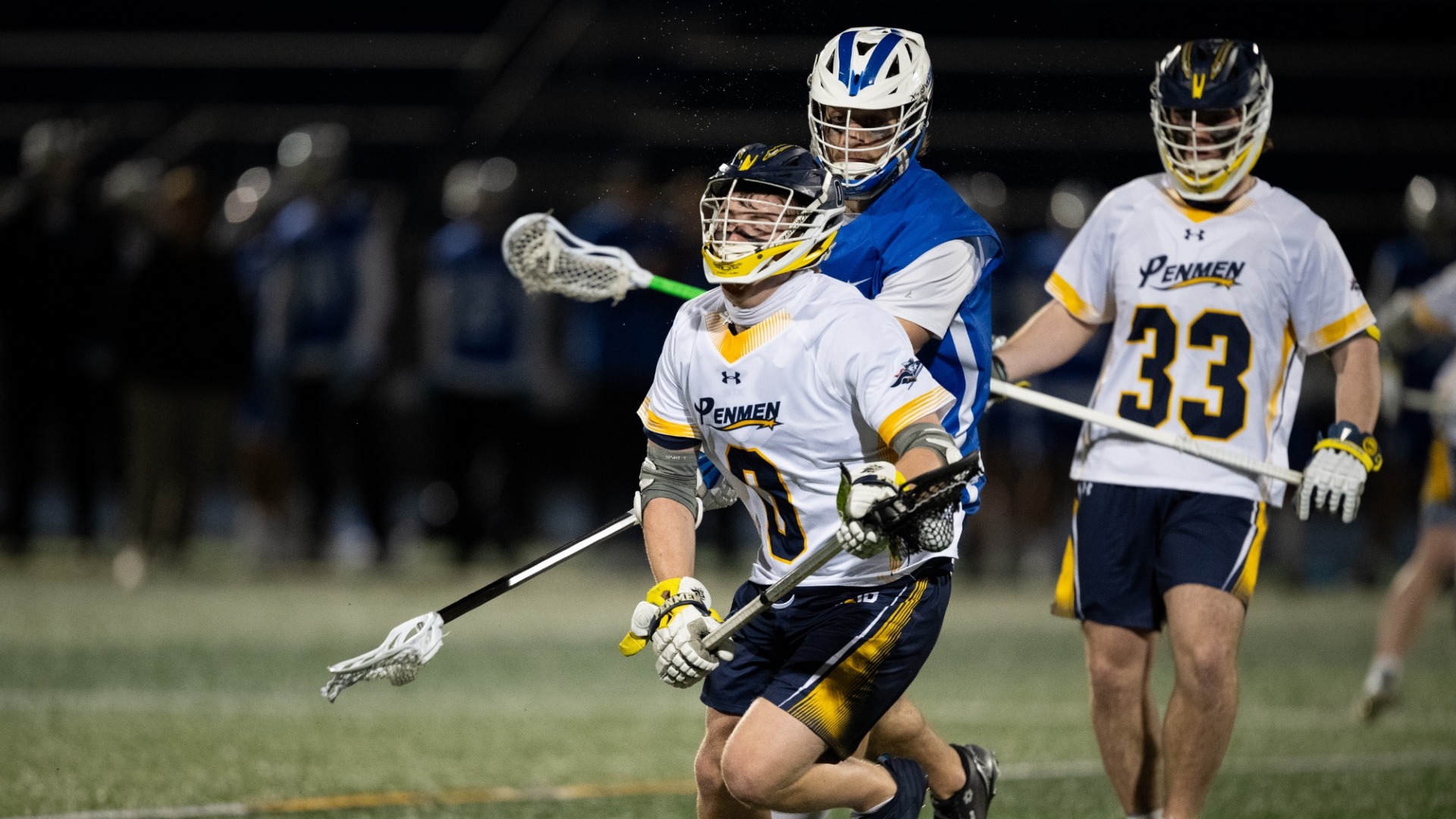 Ryan Lynch and Charlie Pisciotta are battling for a loose ball for SNHU lacrosse