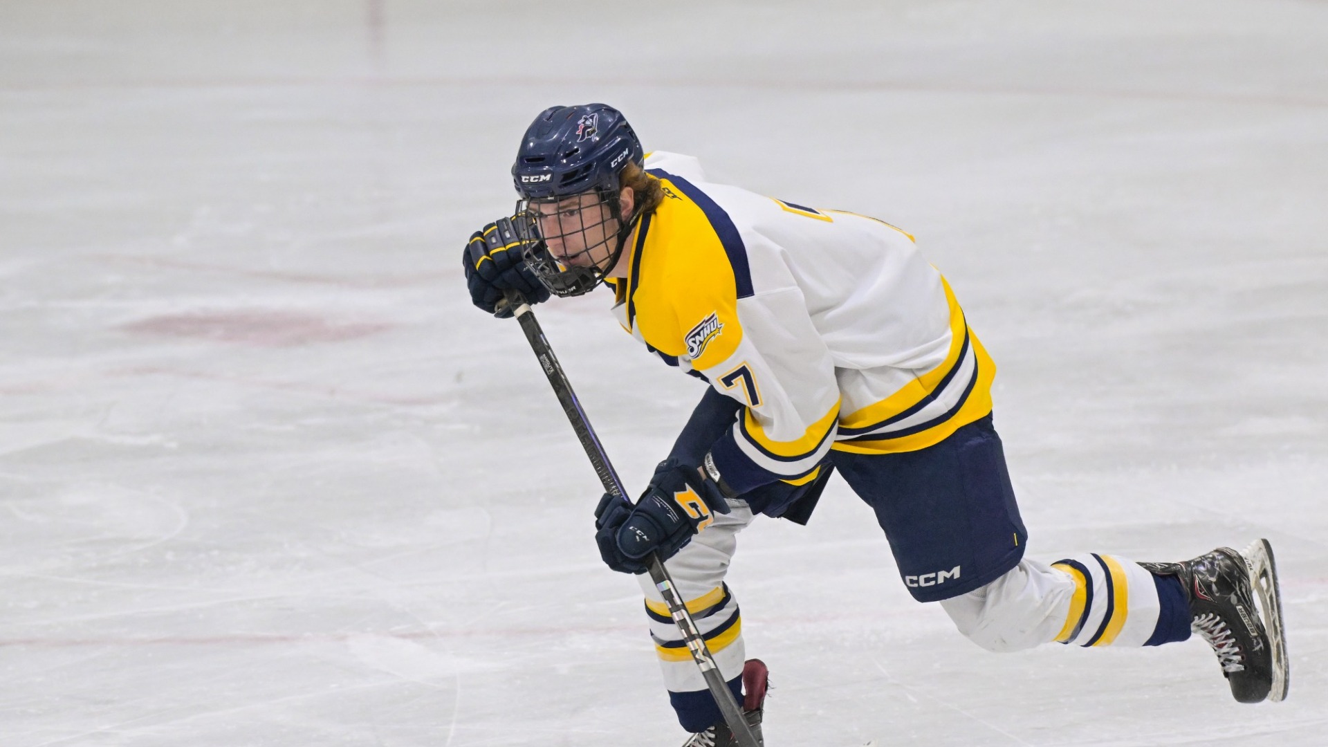 Tyler Murray skates to the puck for SNHU