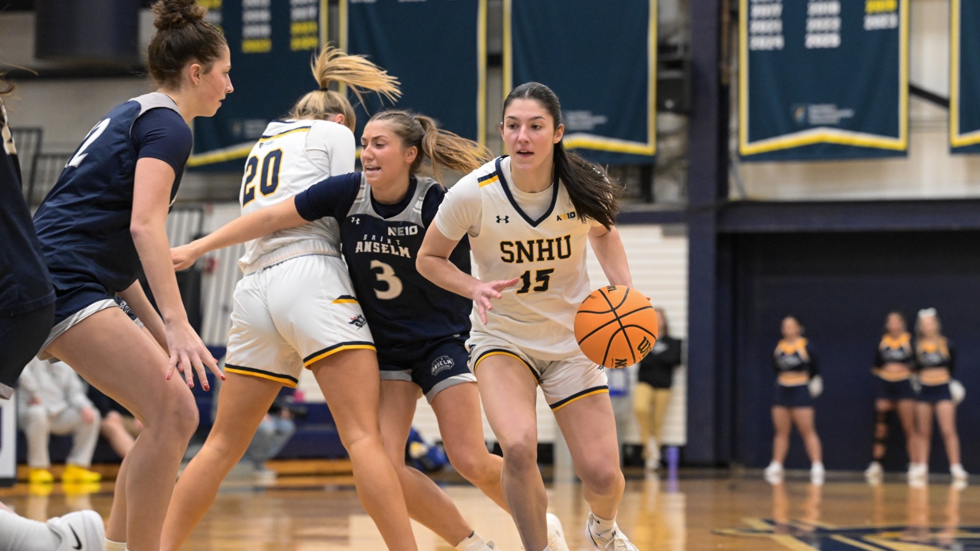 Meghan Gordon dribbles towards the hoop for women's basketball