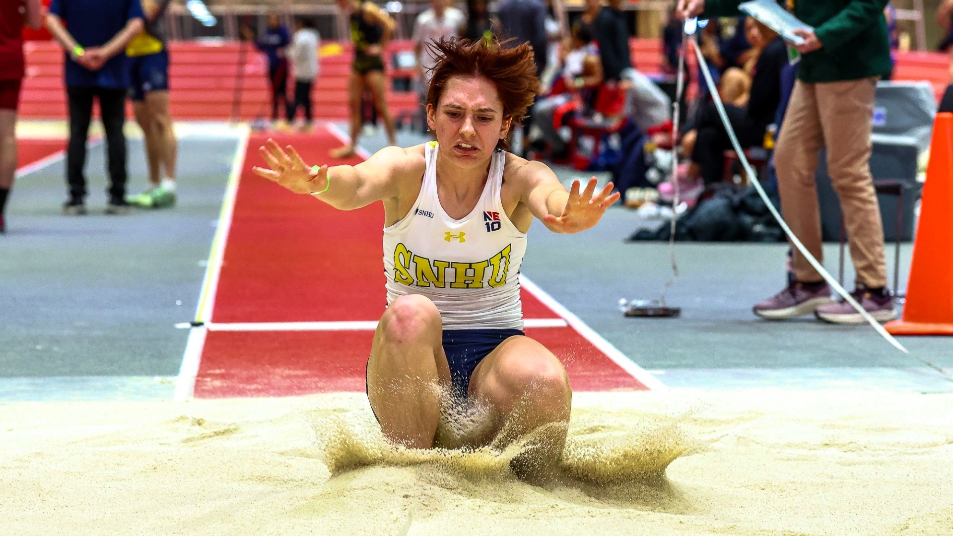 Lily Bower attacks the long jump event indoors