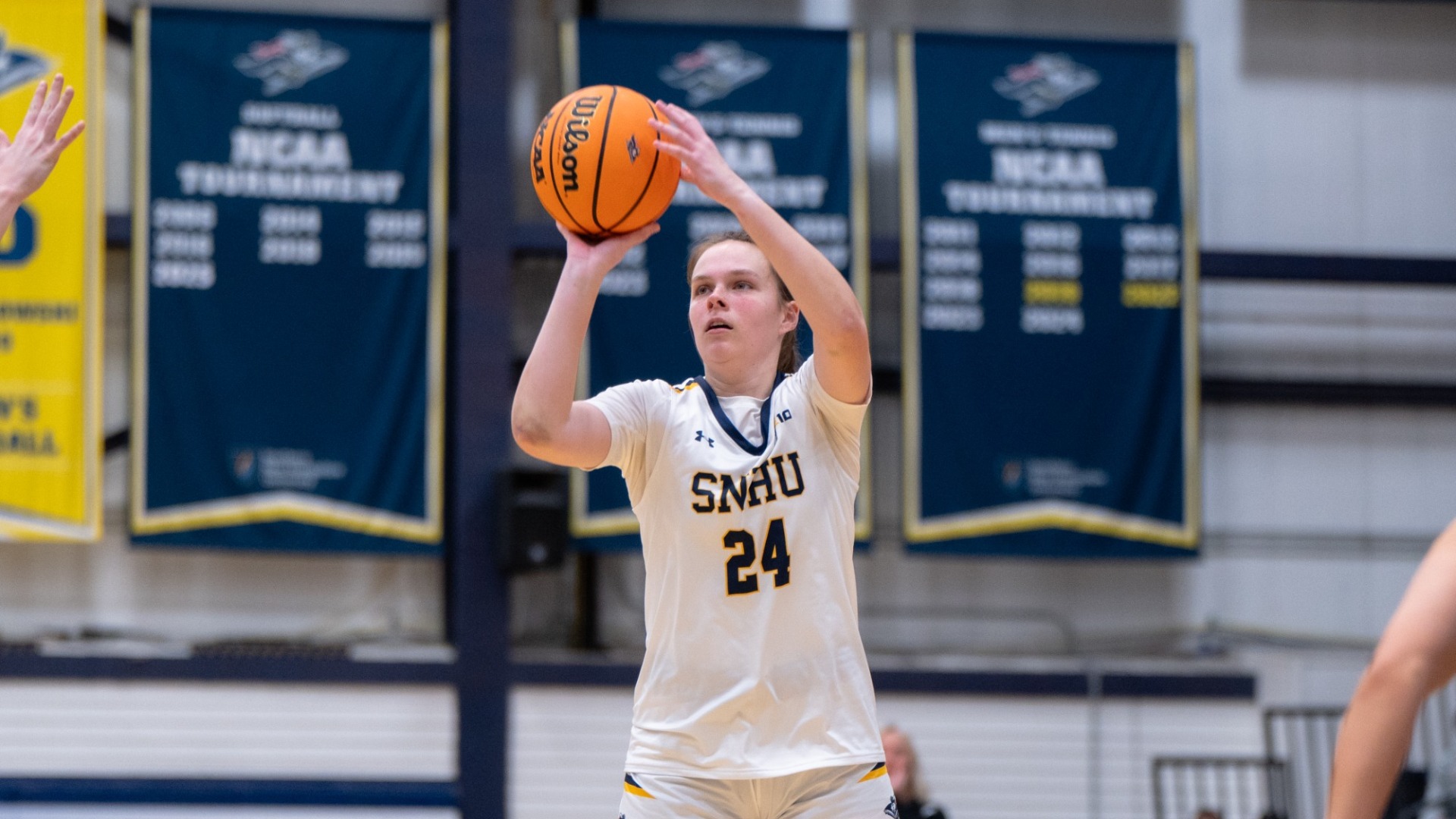 Samantha Pfiel plays offense for women's basketball