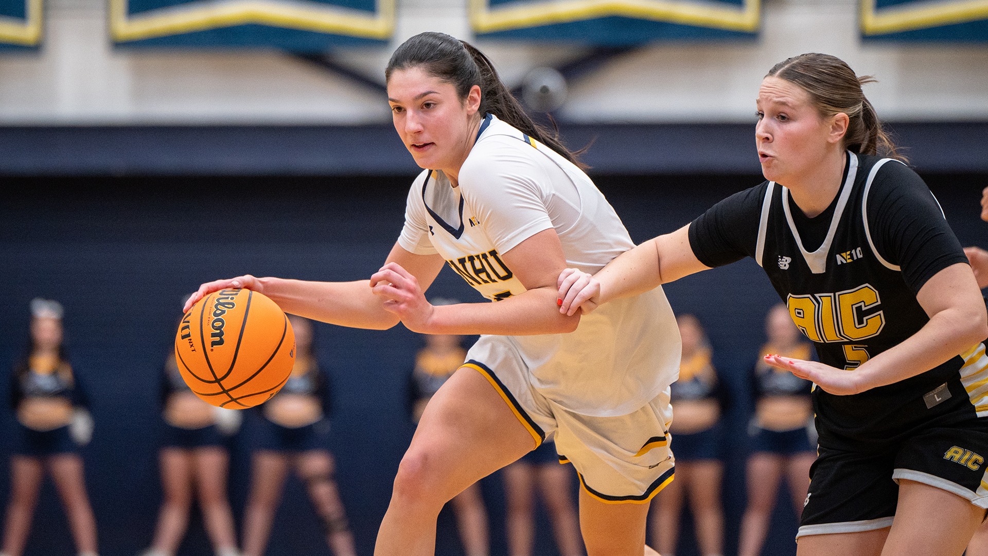 Meghan Gordon driving to the hoop, while being defended