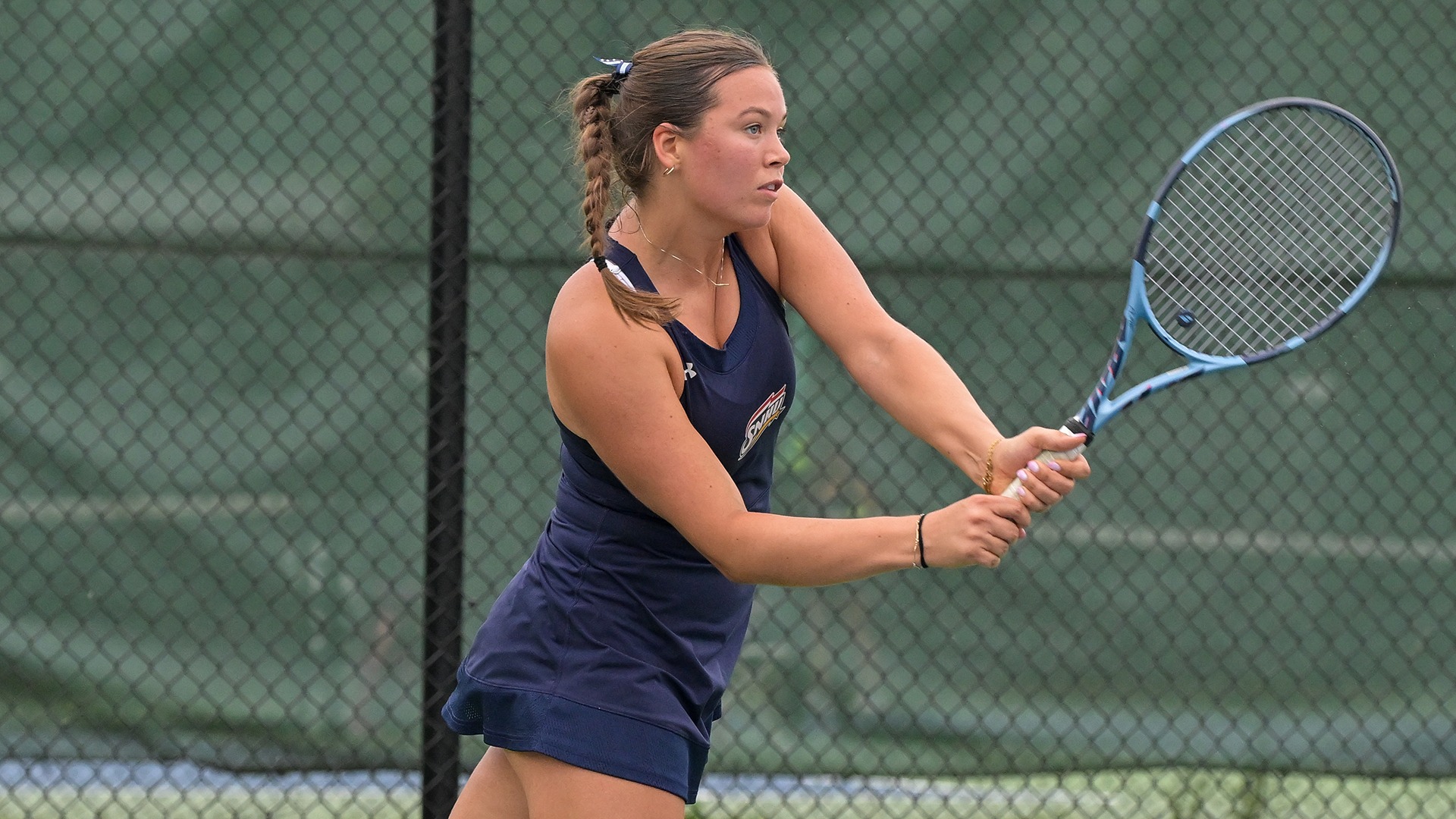 Eyglo Armannsdottir hitting a backhand shot