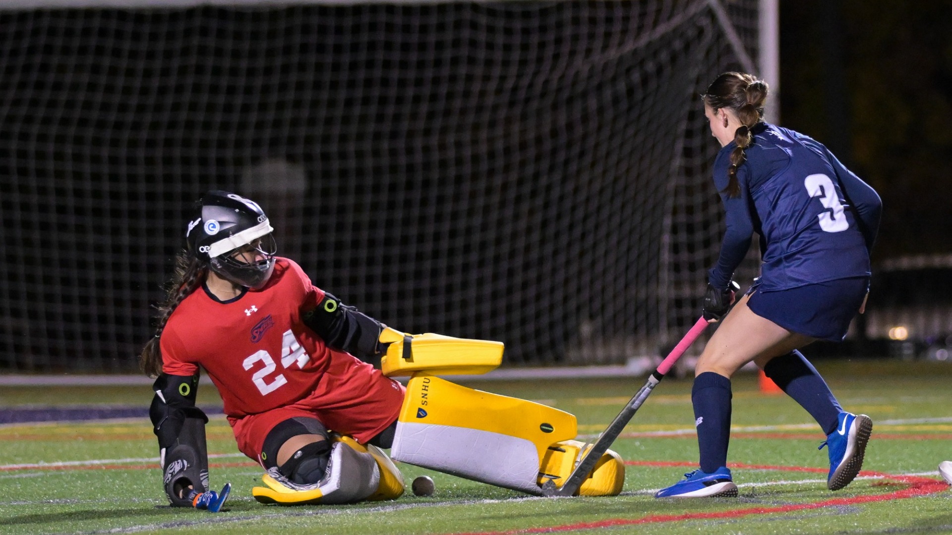 Field hockey goalie Agustina Miranda Waigand lays out to make a save