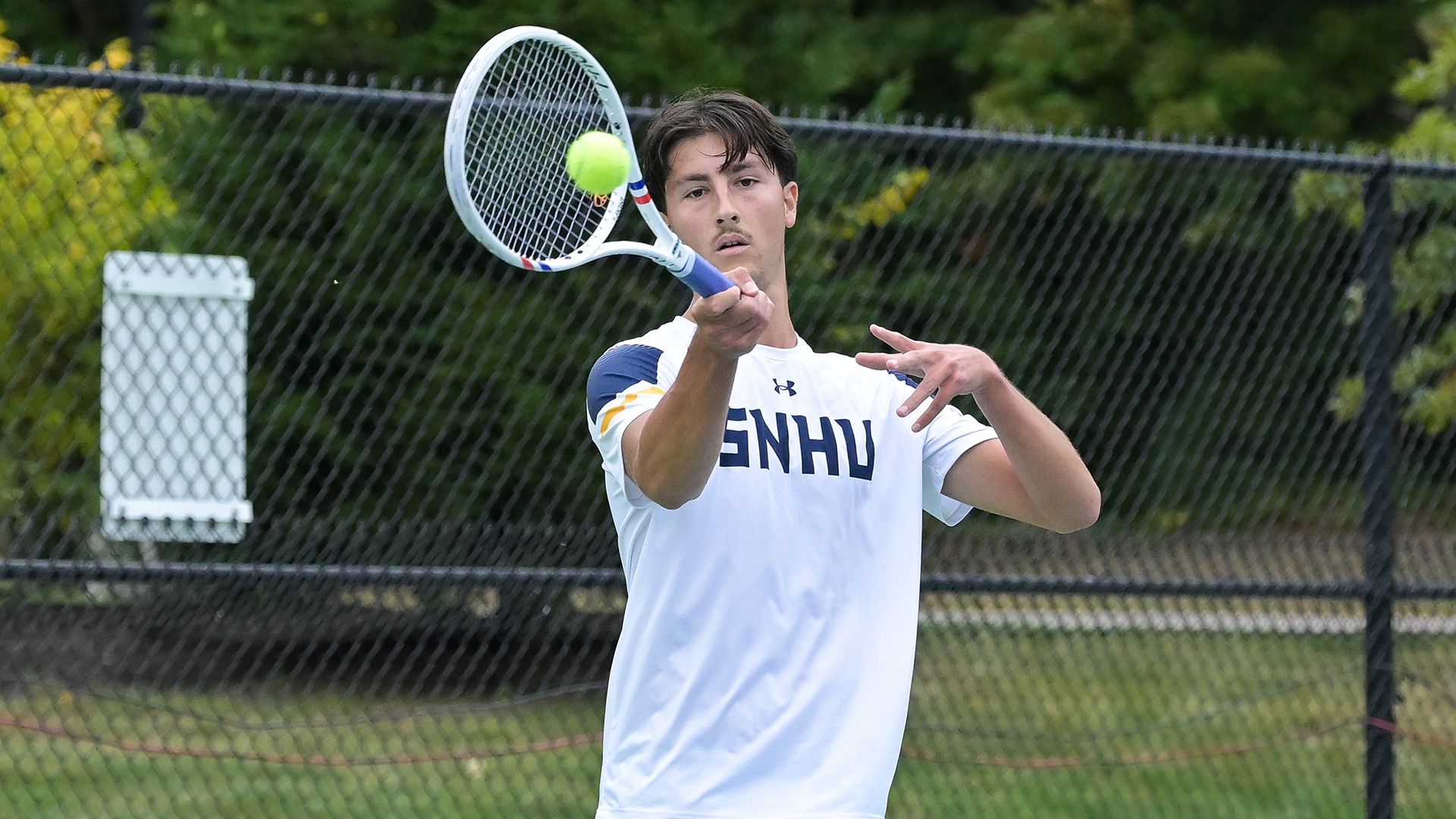 Aurel Creveuil hitting a forehand shot