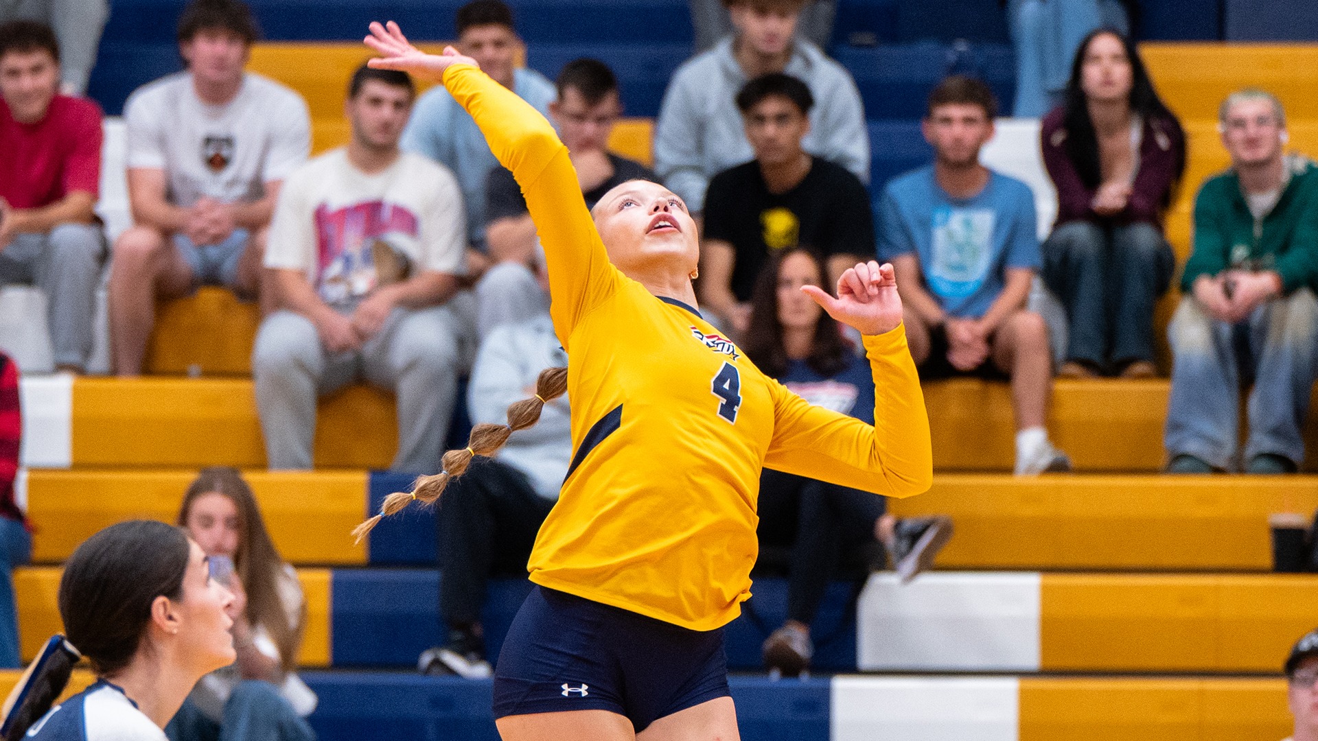 Jordyn Carroll attacking a ball near the net