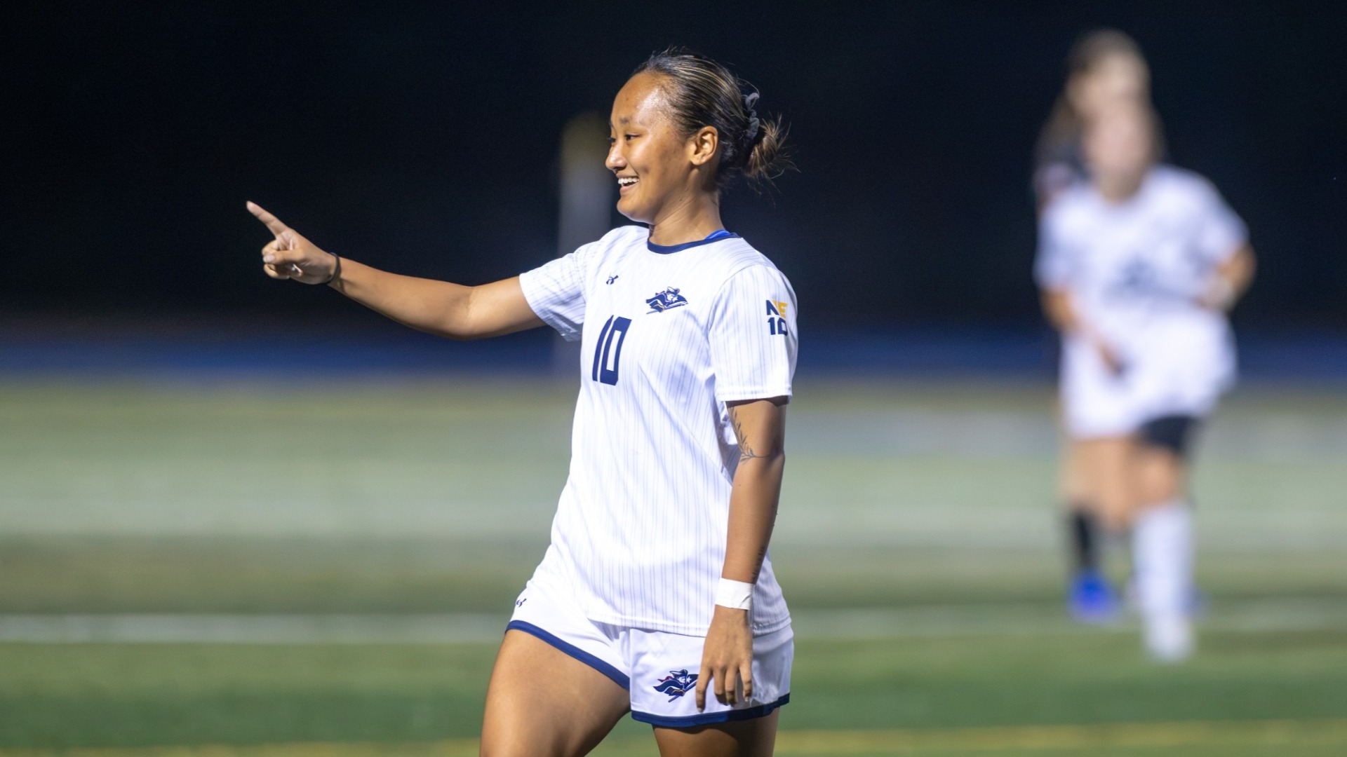 Sneha Limbu of SNHU women's soccer is all smiles after a big play