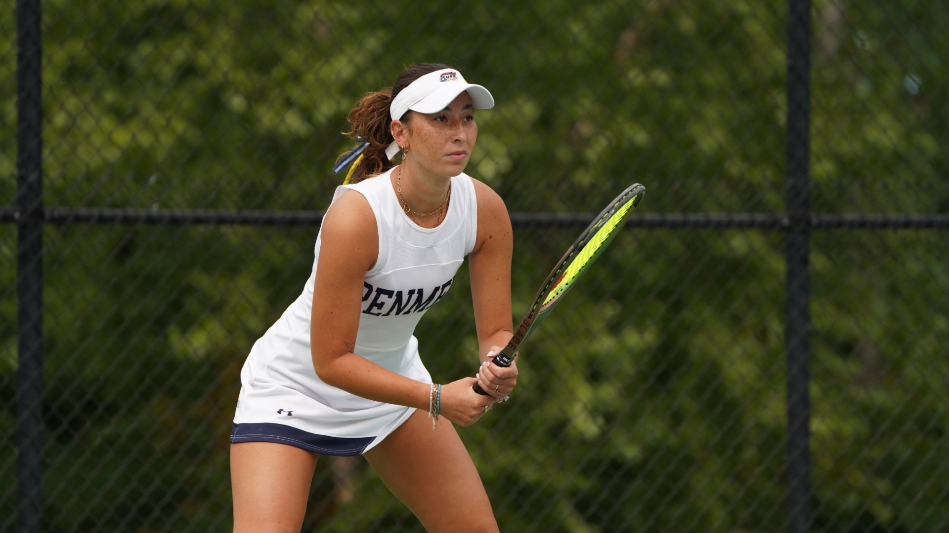 Lois Tsui of women's tennis waiting for a serve