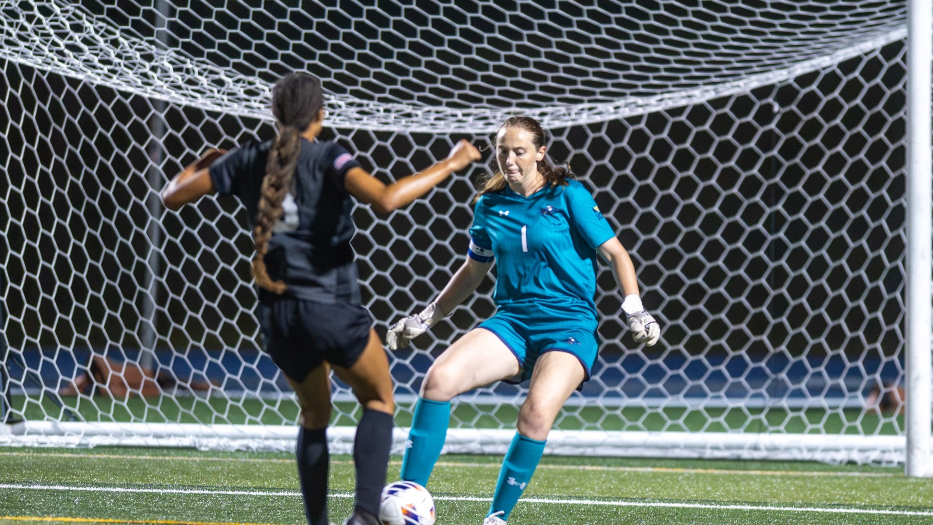 Isabel Hughes of women's soccer defending her goal