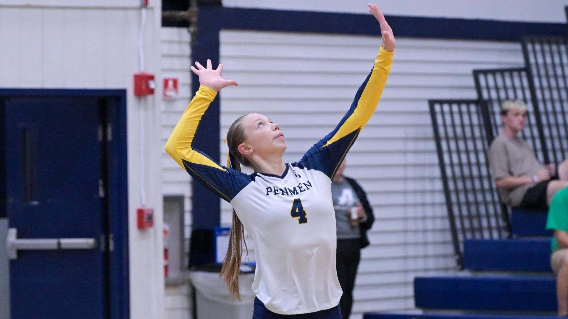 Jordyn Carroll of SNHU volleyball about to serve 