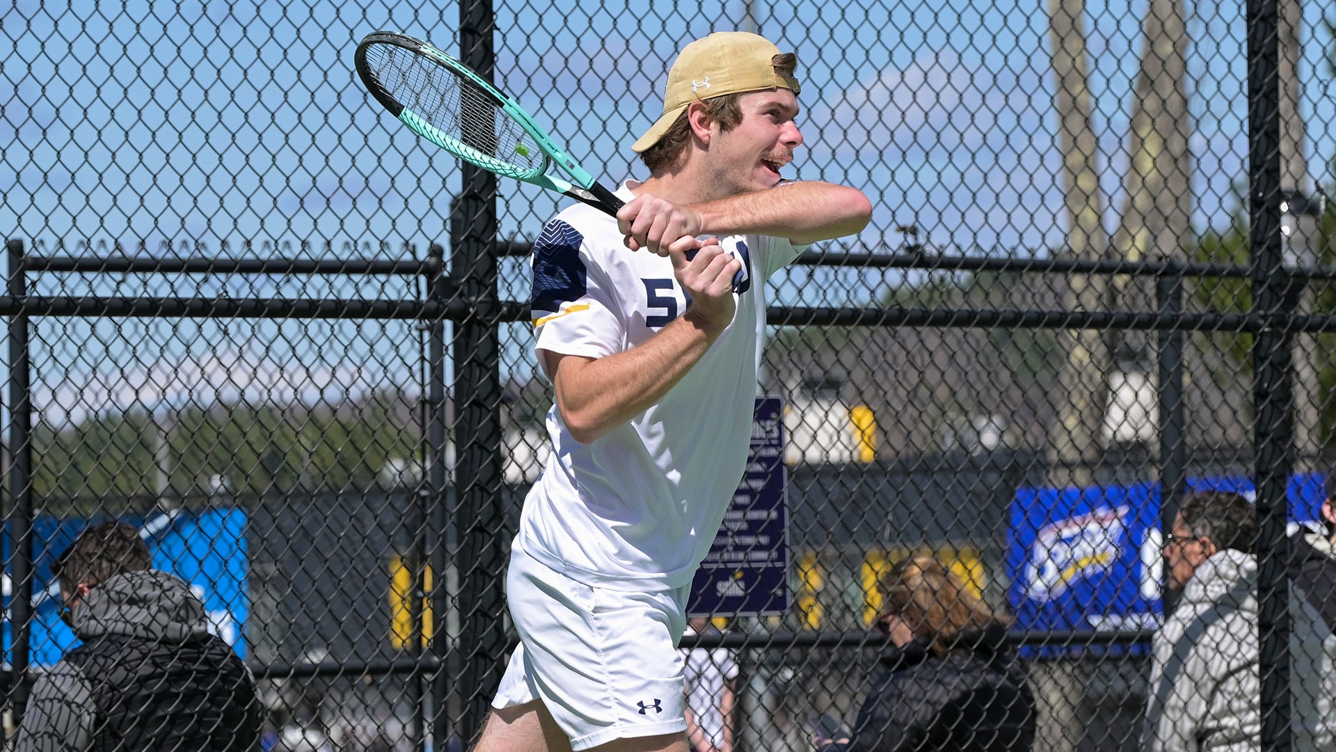 Tristan Chandler hitting a backhand shot