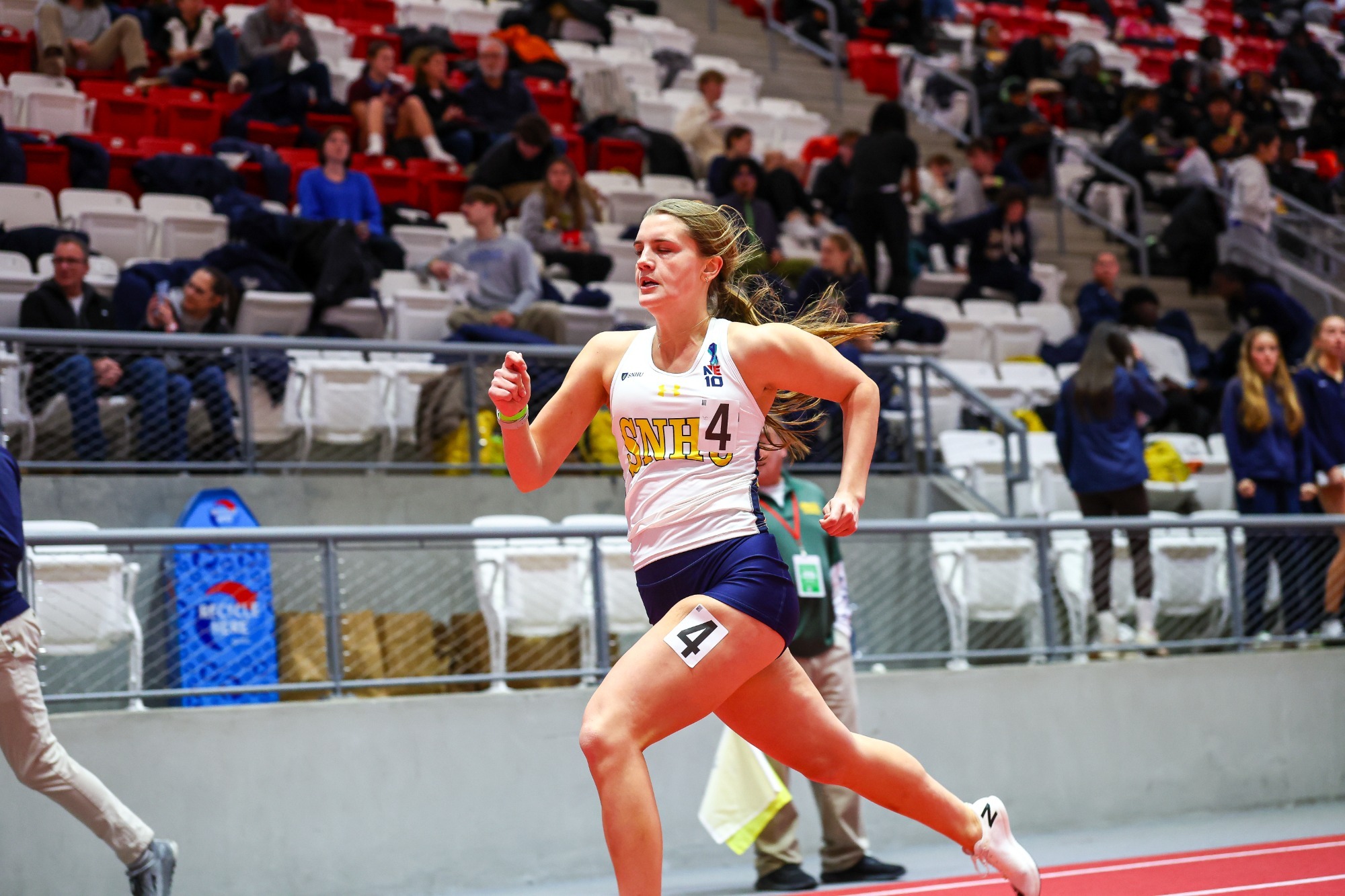 Kay Wheelock running an indoor race 