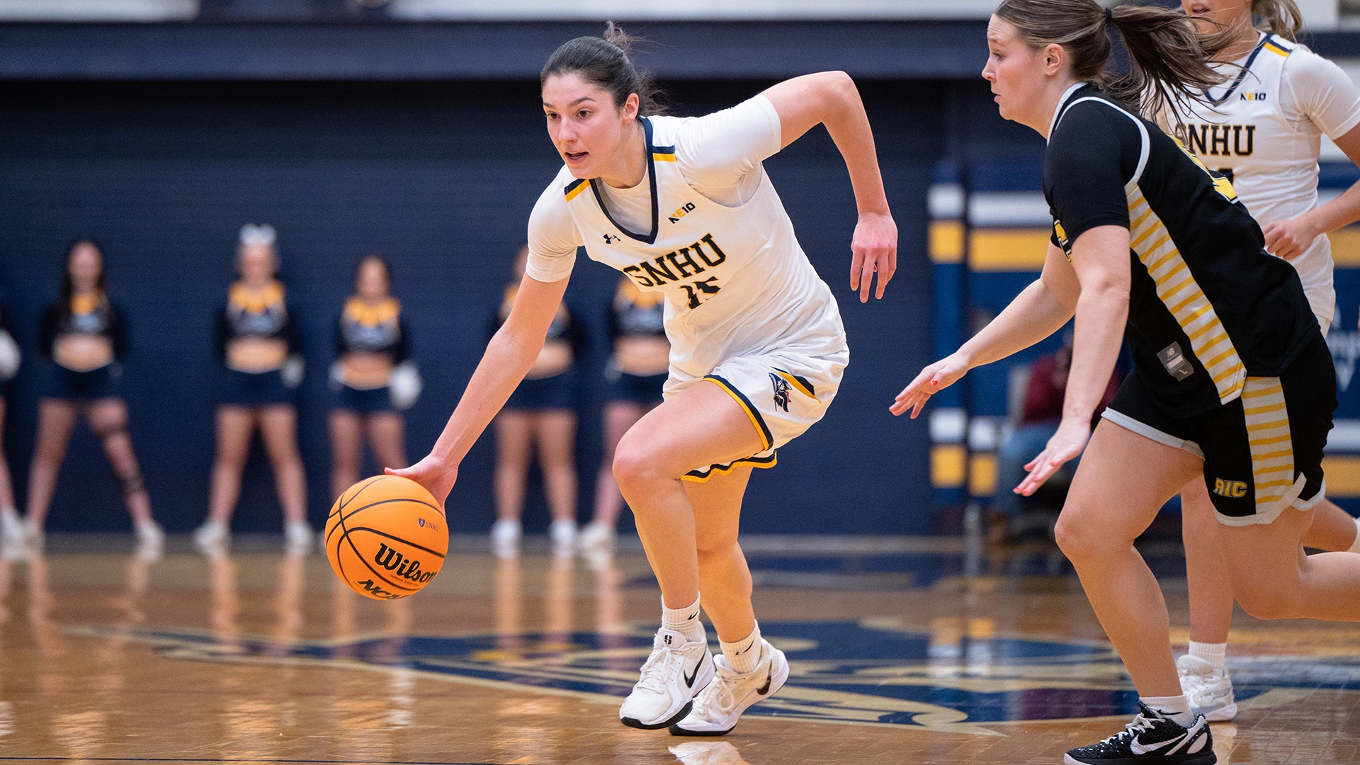 Meghan Gordon dribbling against a defender