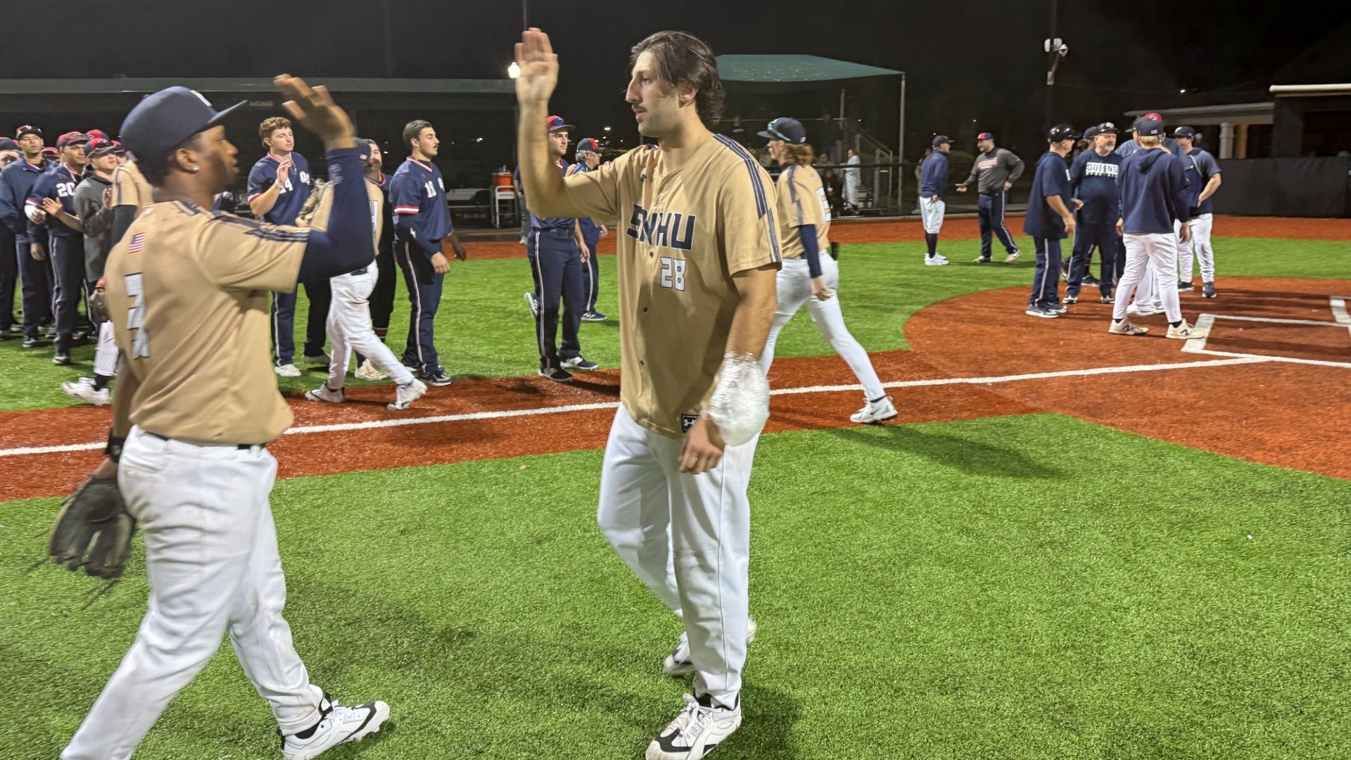 Jake Pisano congratulates Joel Valera in Myrtle Beach after a win over Queens