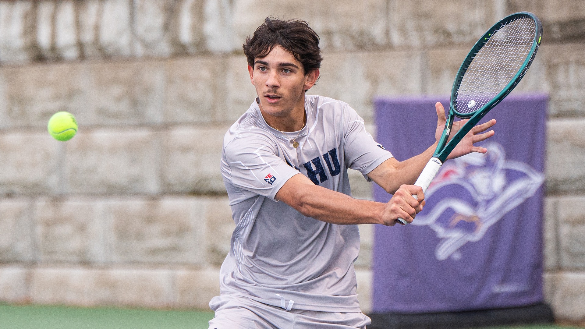 Noah Cadilhac hitting a backhand shot