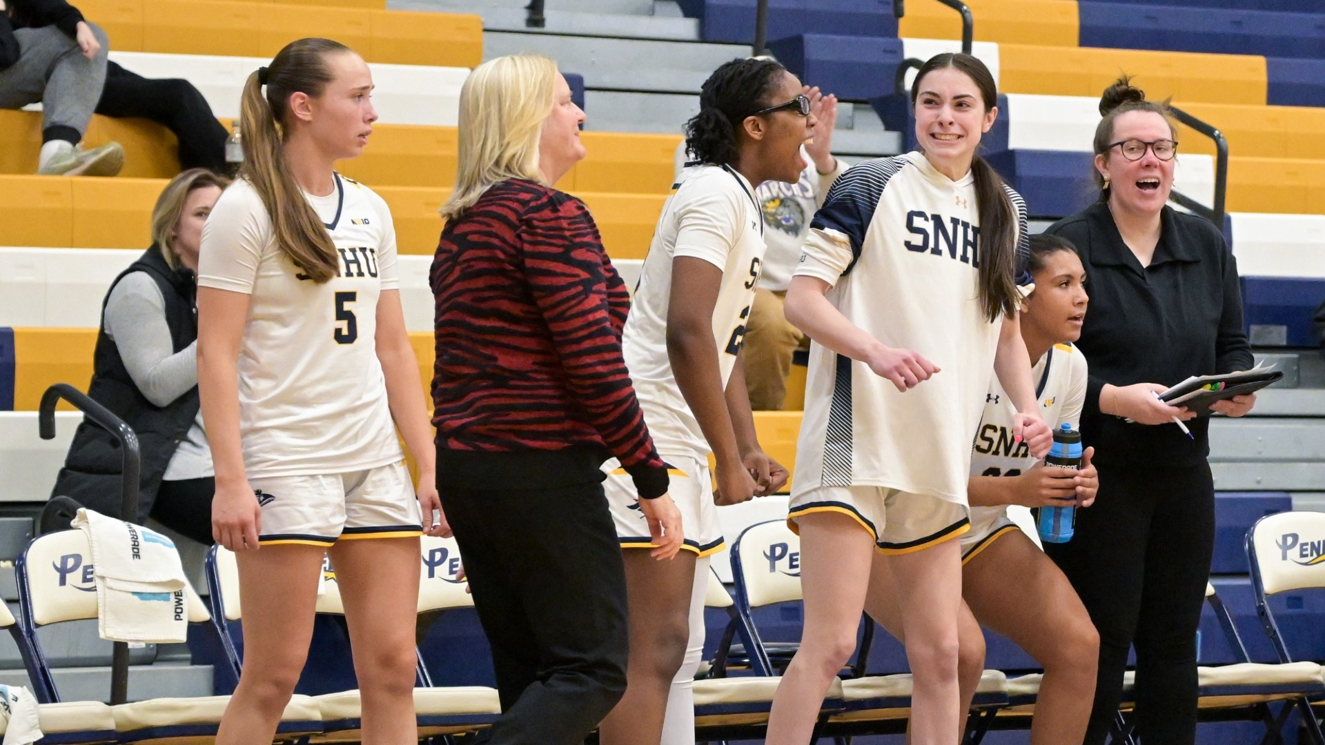 Coach Pinkos coaches her team from the sidelines