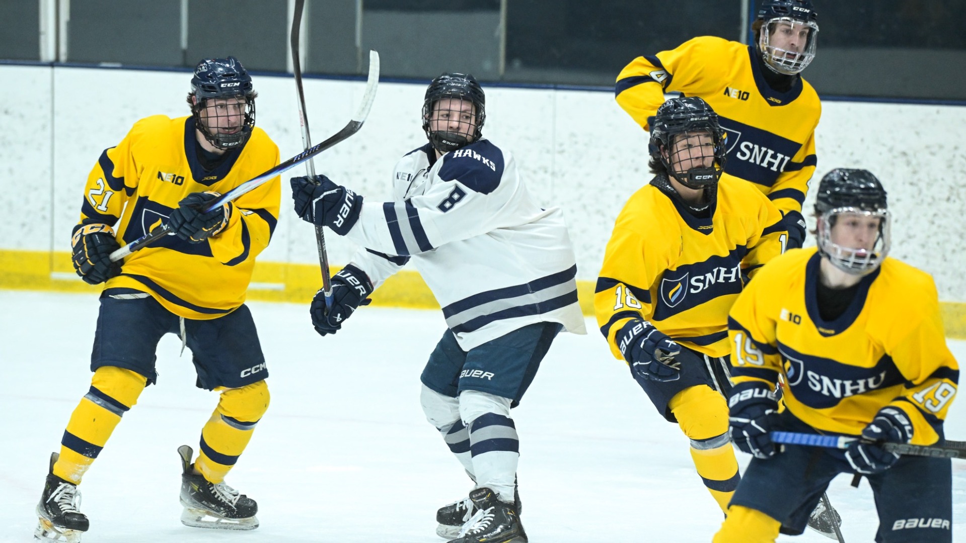 Stone Devlin, Jory Veenstra, Bryan Kim, and Ryan Kayser of men's hockey in the playoff game at Saint Anselm