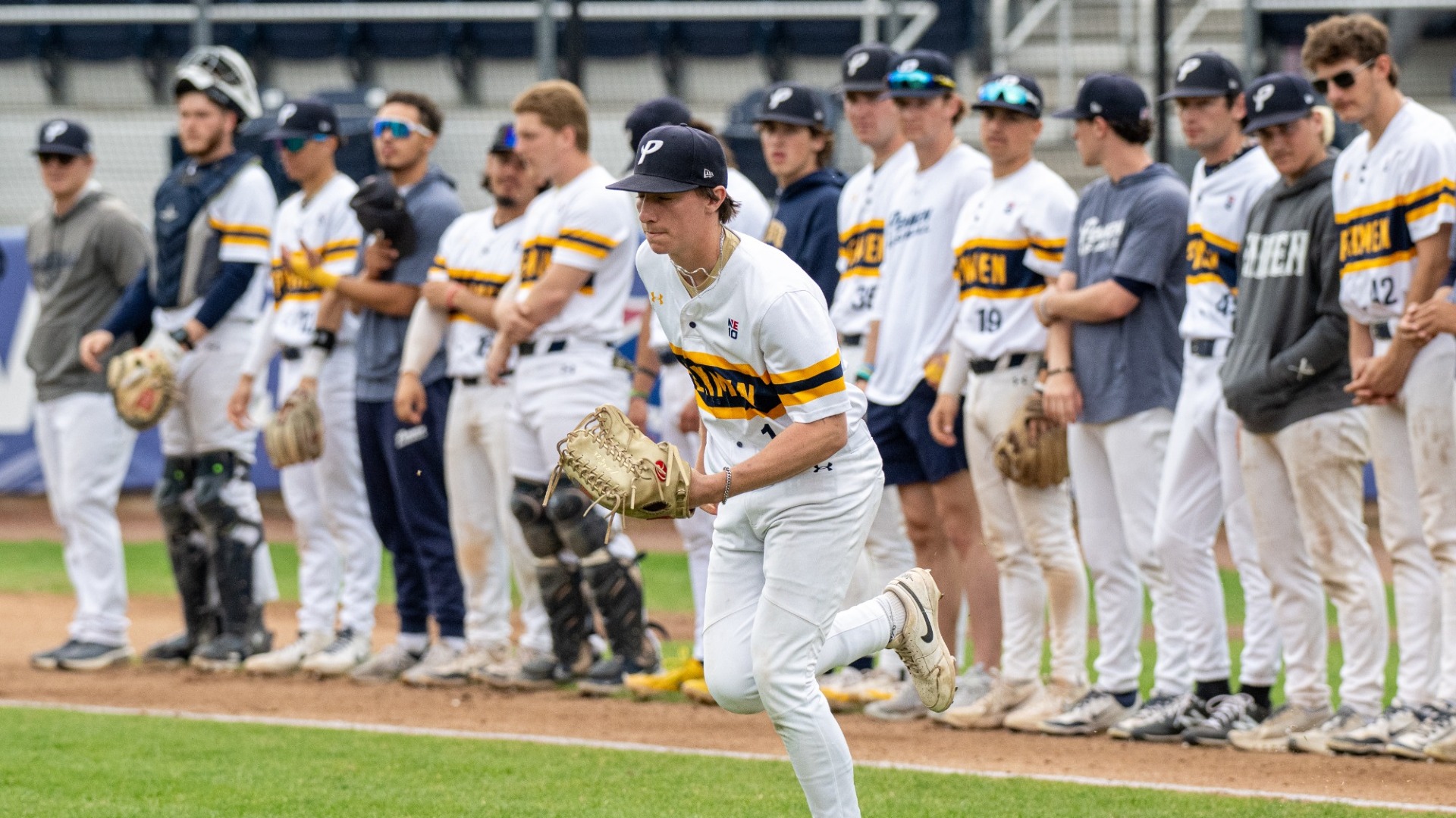 Jake Risedorf of baseball leads the team out onto the field