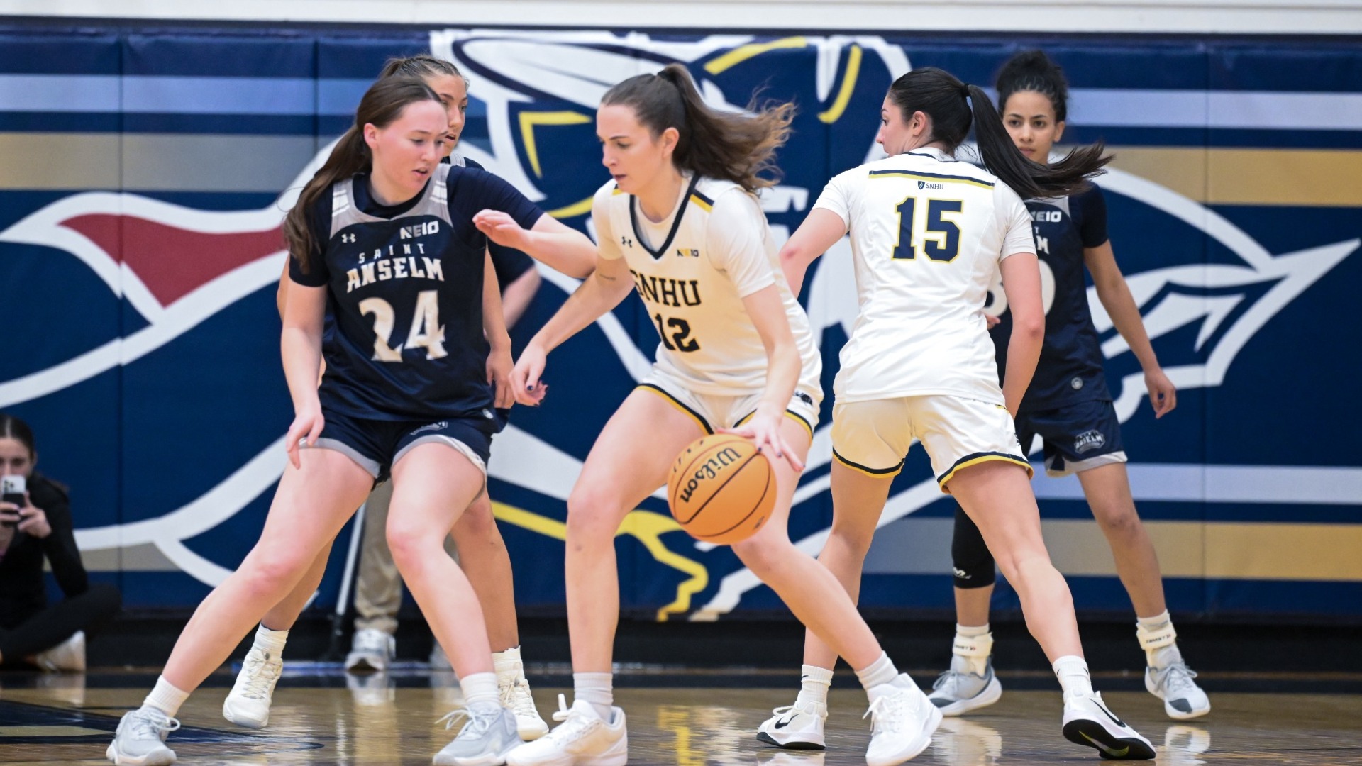 Ava Winterburn and Meg Gordon look for some points for women's basketball