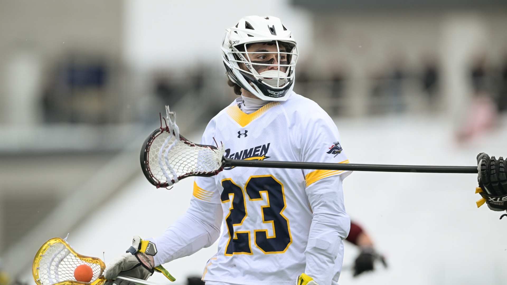 Joey Gallo is pictured in a white uniform with his lacrosse stick in his hand