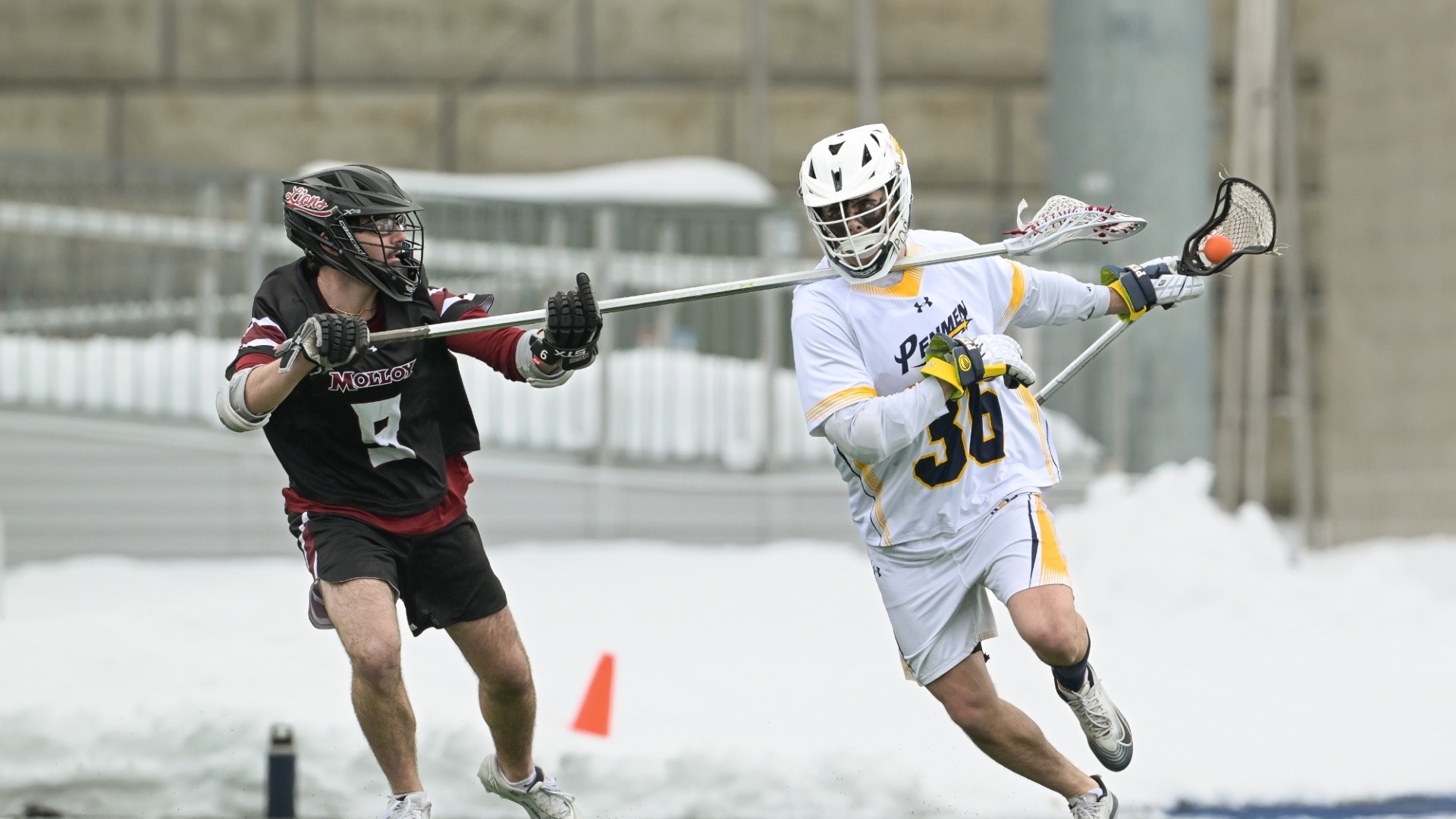Sean Dwyer challenges a defender for men's lacrosse