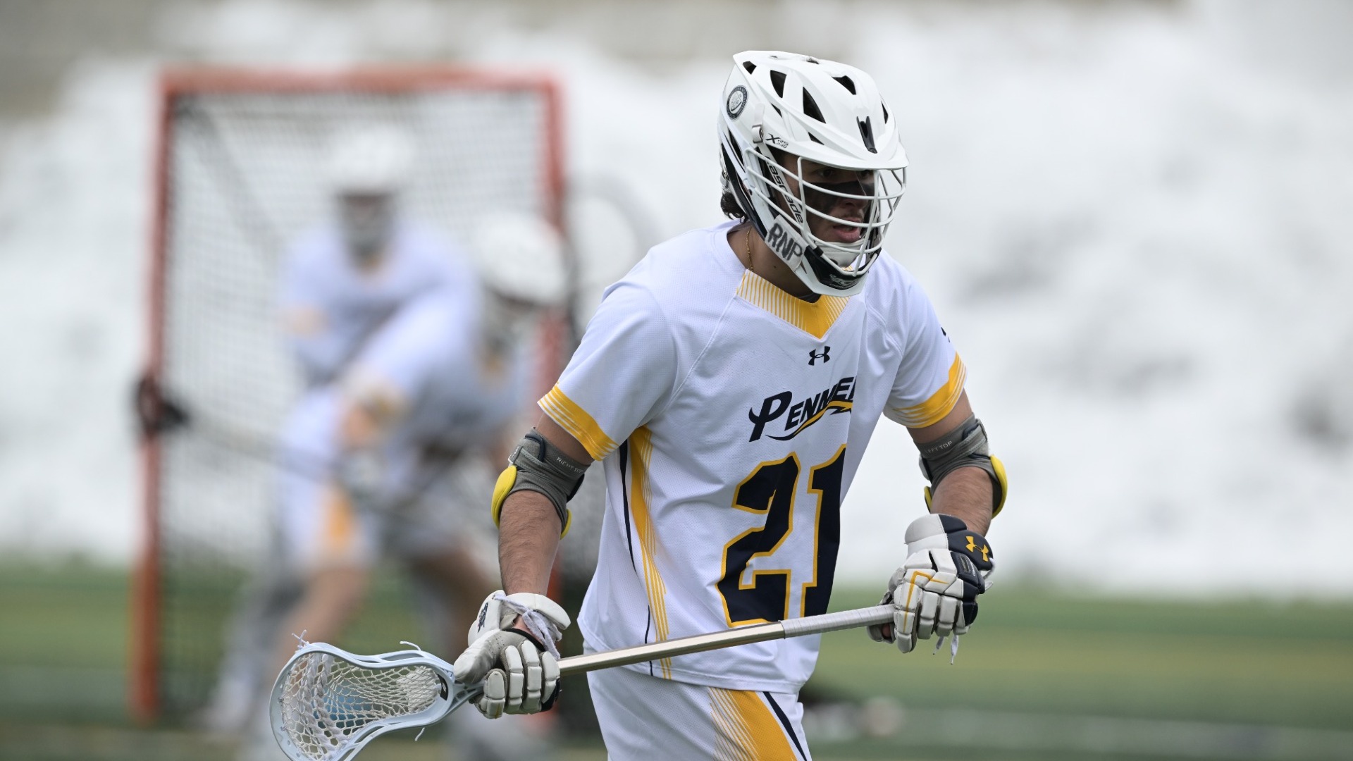 Christian Perez of men's lacrosse is shown in an action shot holding his cross