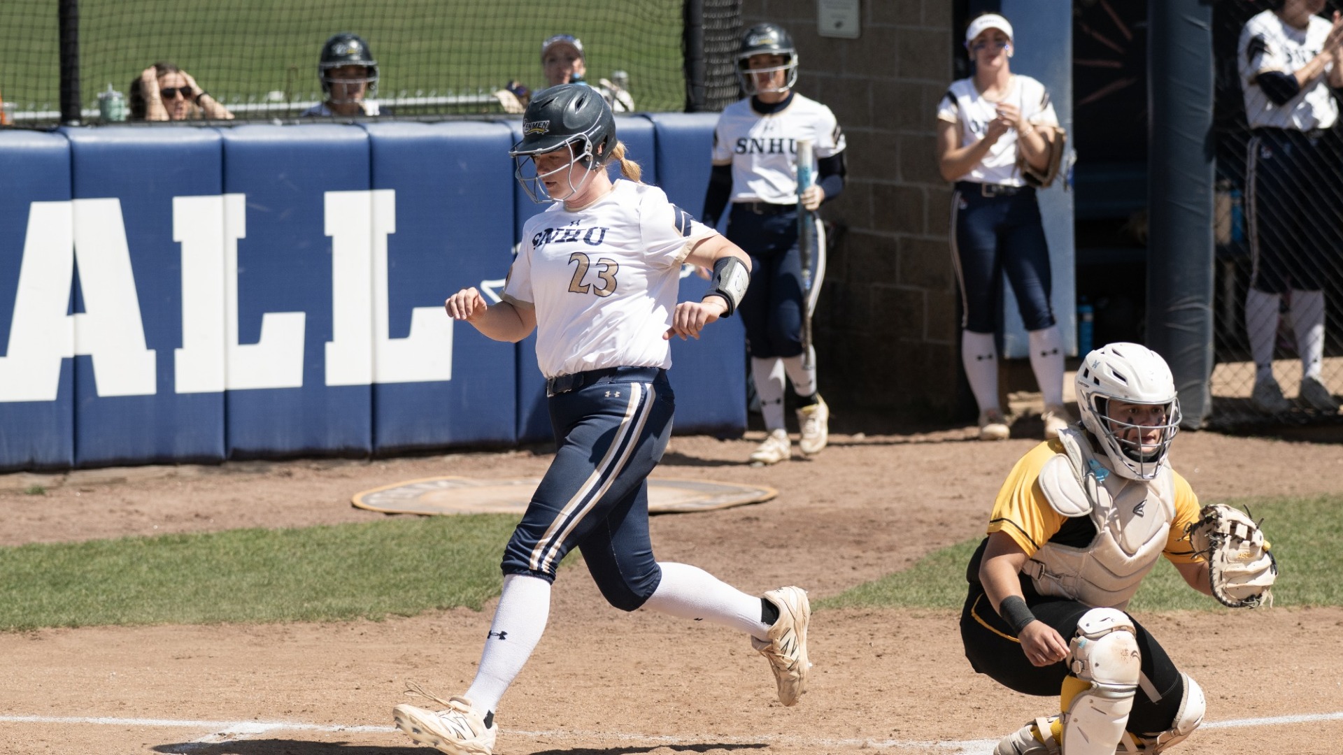 Abby Lineman scores a run for SNHU softball