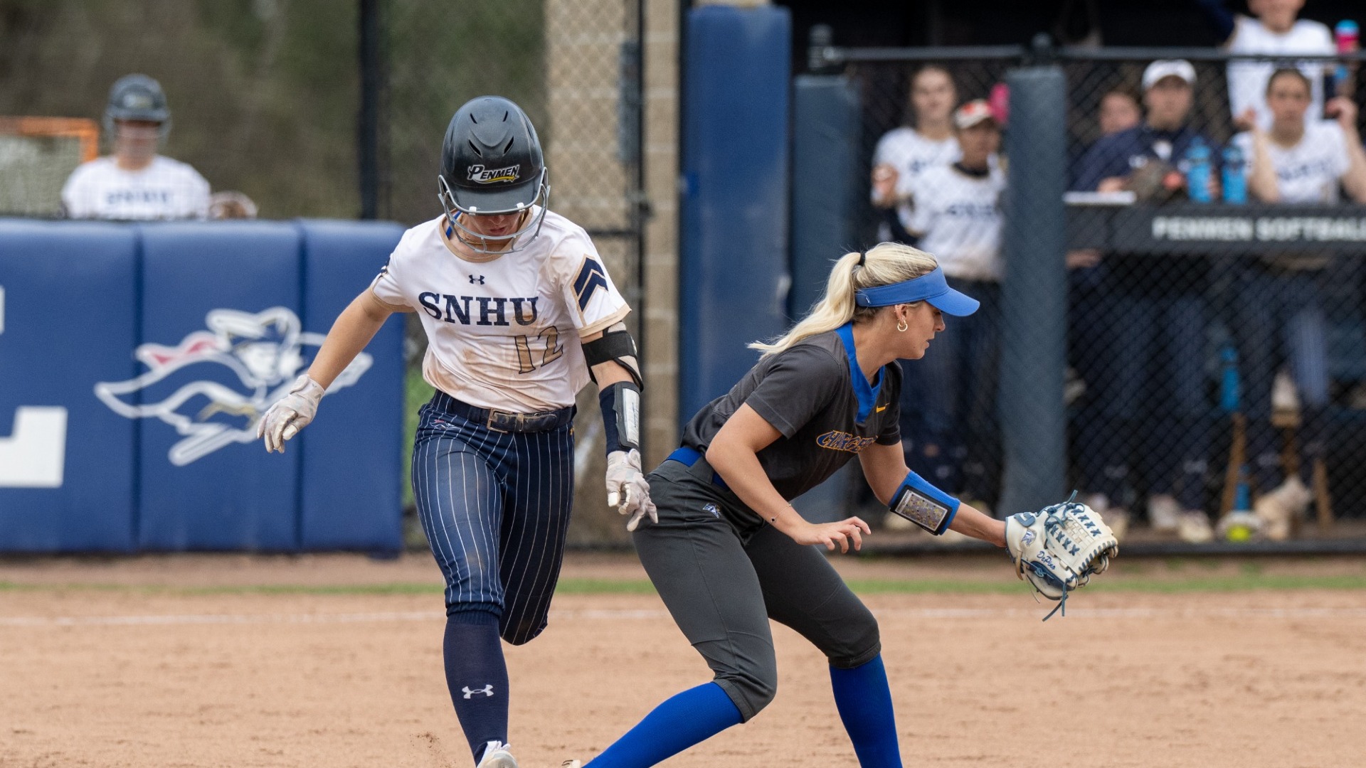Kaysie DeMoura races down the line trying to beat out a hit
