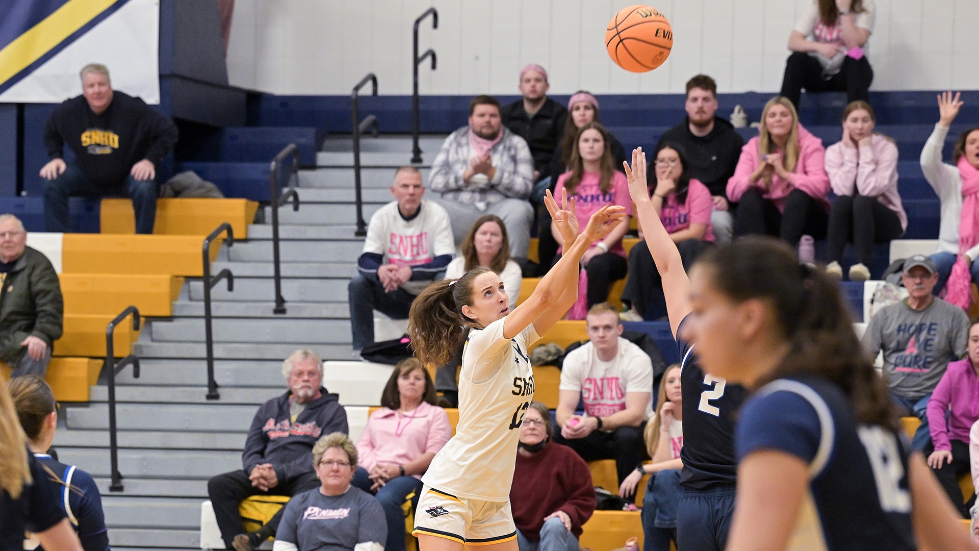 Ava Winterburn shooting a contested 3-pointer with an opponent in the foreground