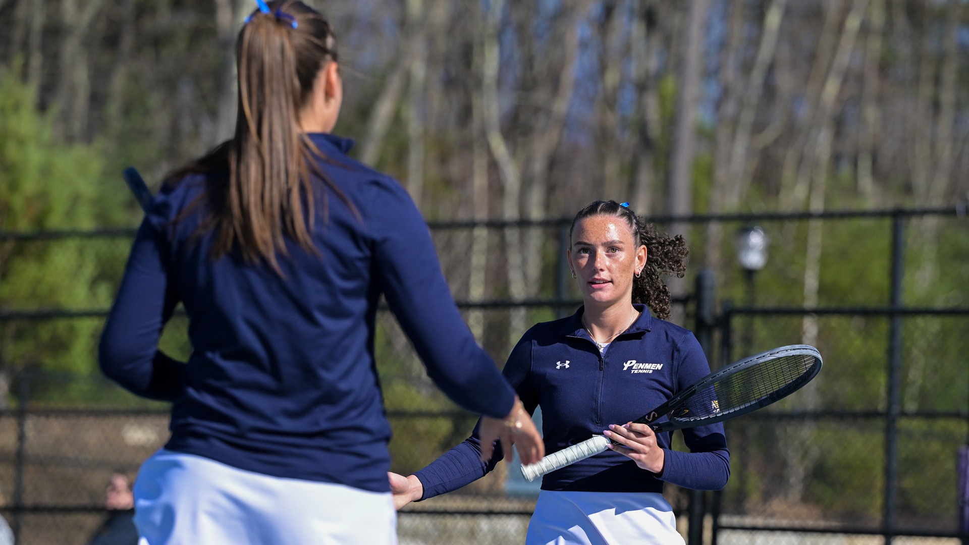Eyglo Armannsdottir and Megan Leck celebrating a point during their doubles match