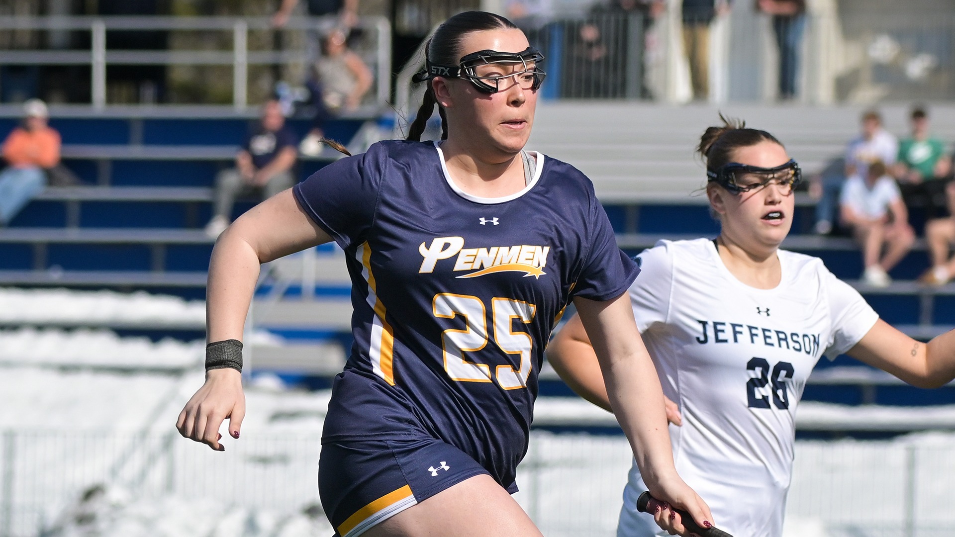 Sierra Kimball running after a loose ball with an opponent in the background