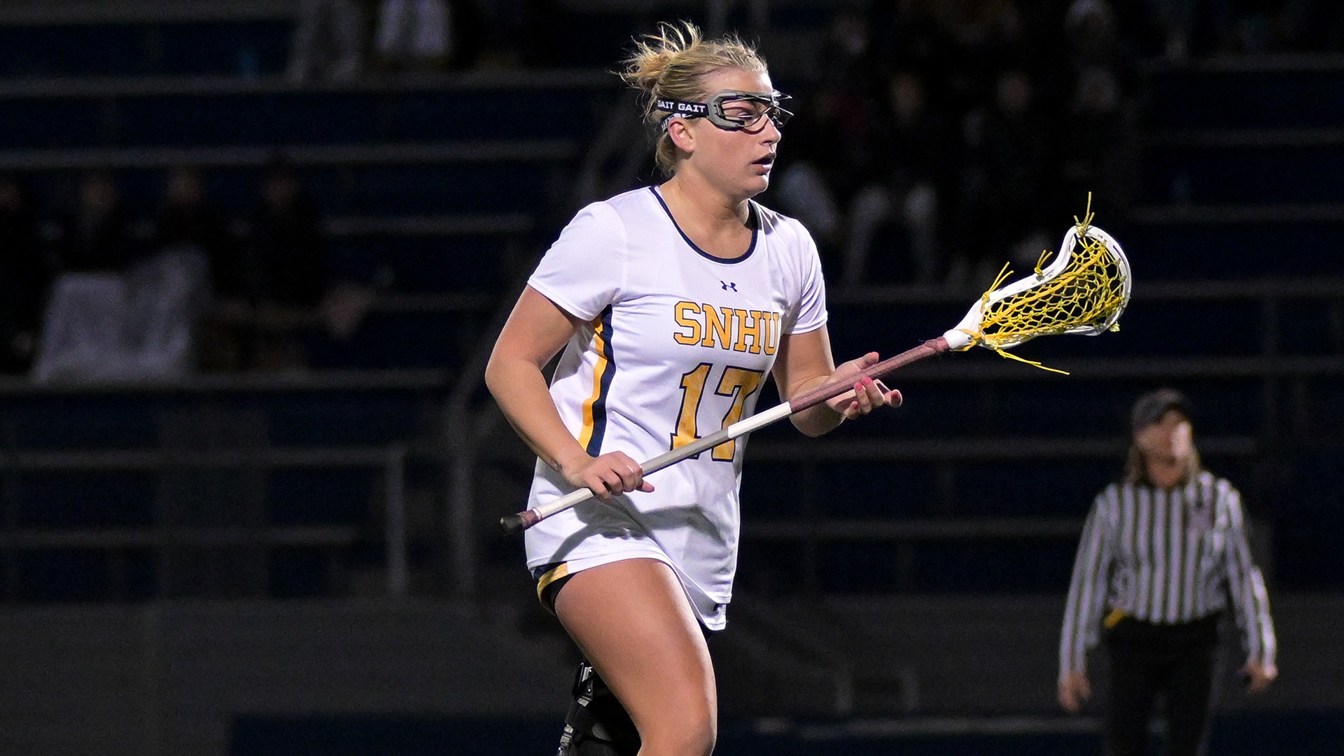 Brynn Goulet standing on the field with her stick