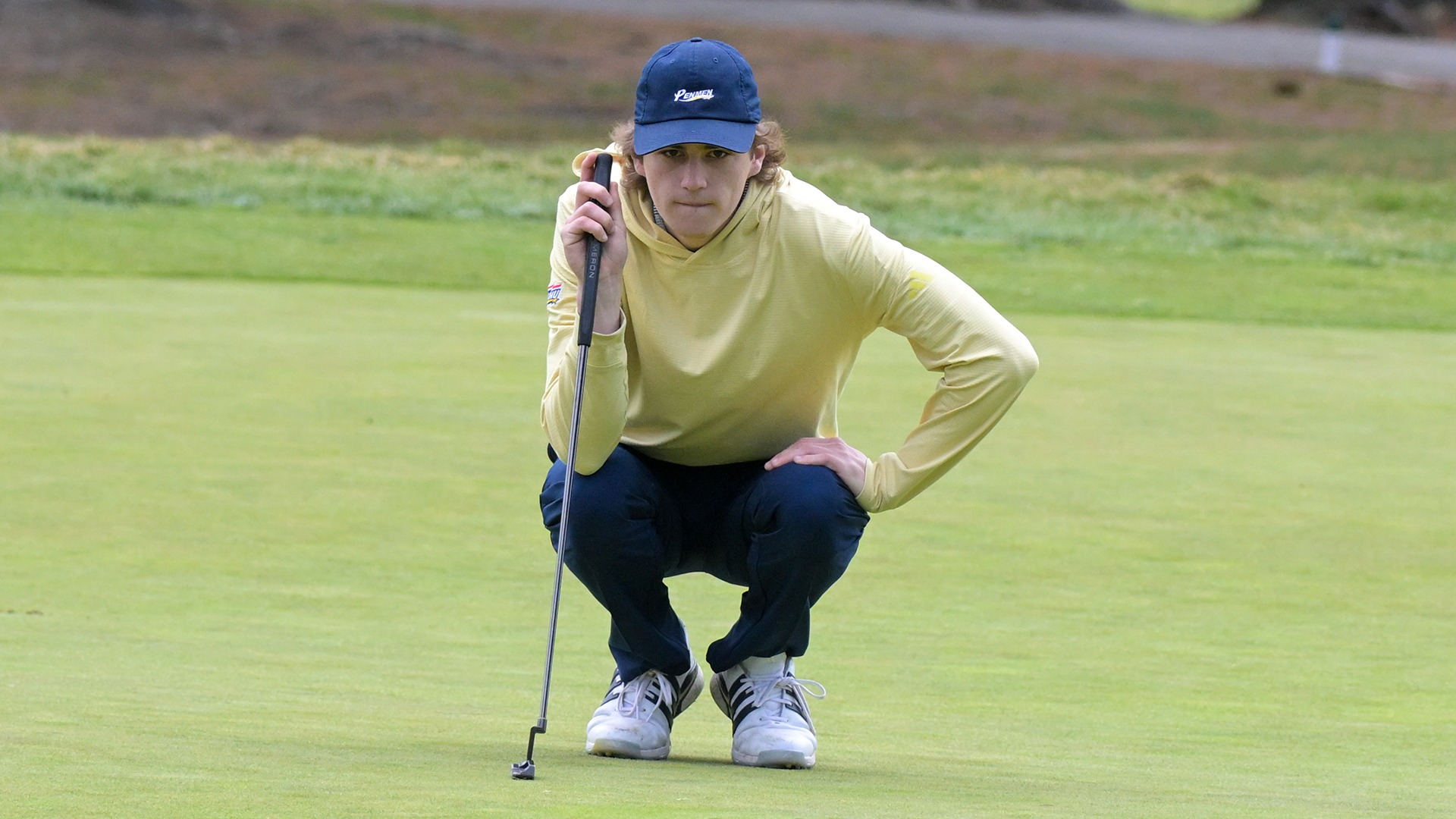 Gavin Richardson crouched down with his putter