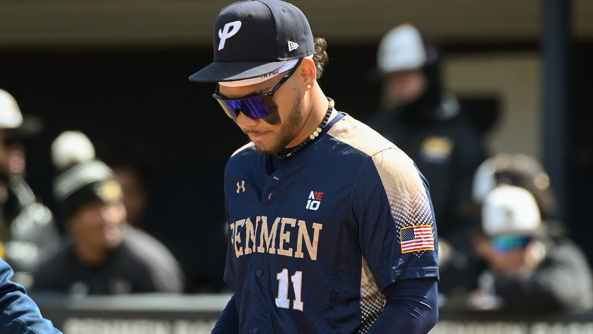 Christian Cepin looking down, while standing near home plate