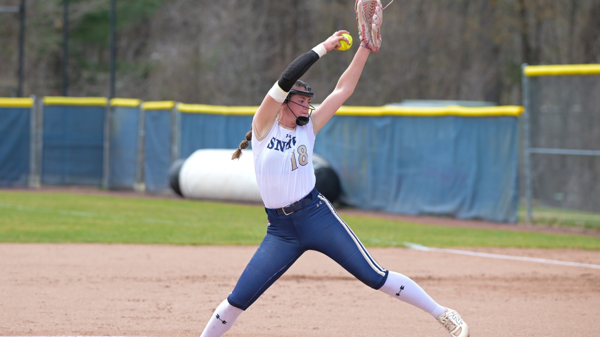 Julianna Colbert of softball winds up to deliver a pitch