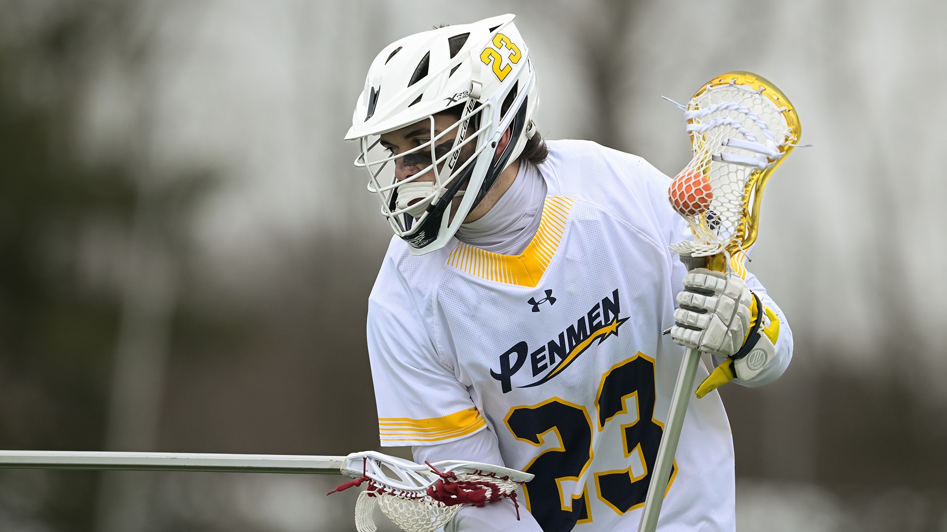 Joey Gallo being checked by an opponent with the ball in his stick