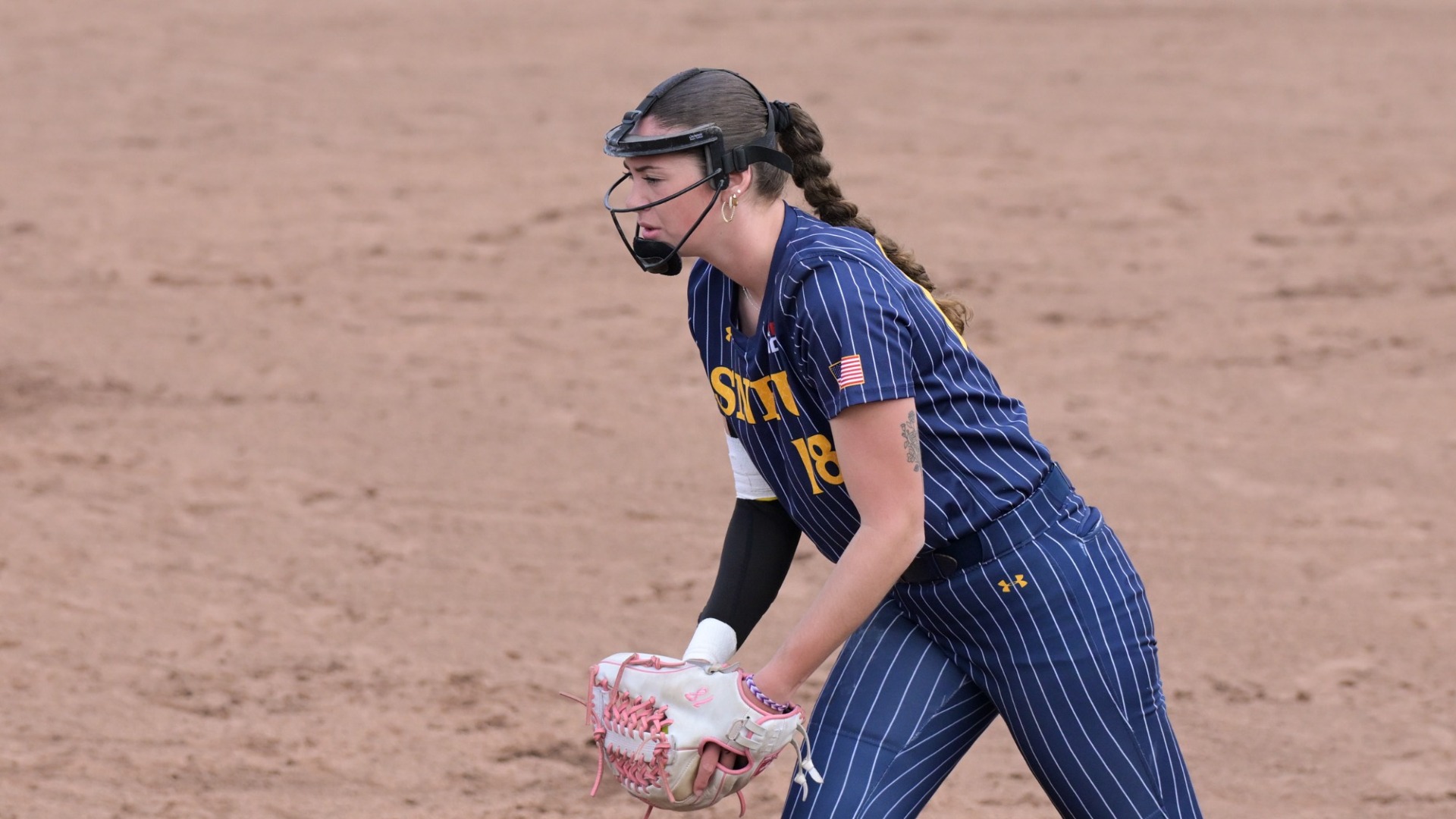 Pitcher Julianna Colbert of SNHU softball prepares to deliver a pitch