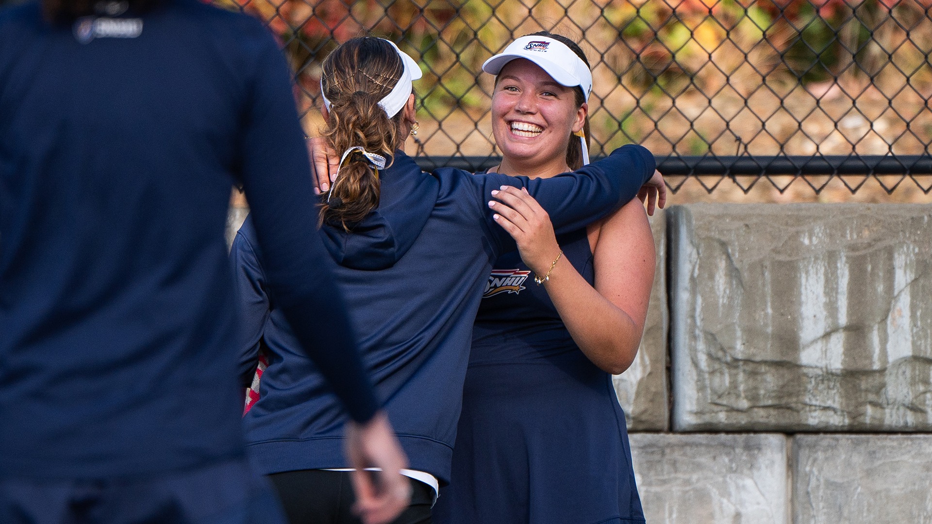 Eyglo Armannsdottir hugging her teammate after a win