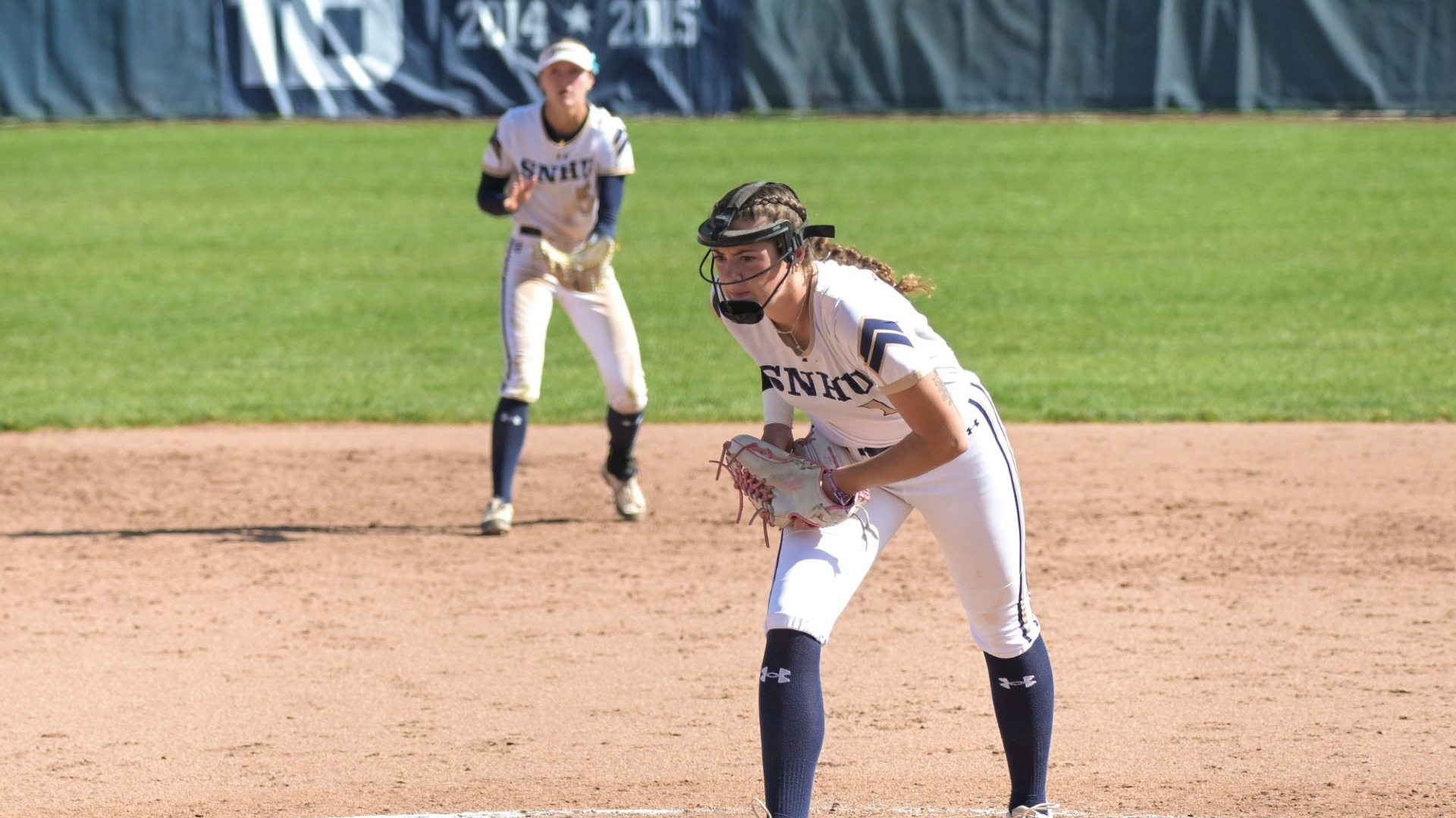 Julianna Colbert prepares to throw a pitch for softball